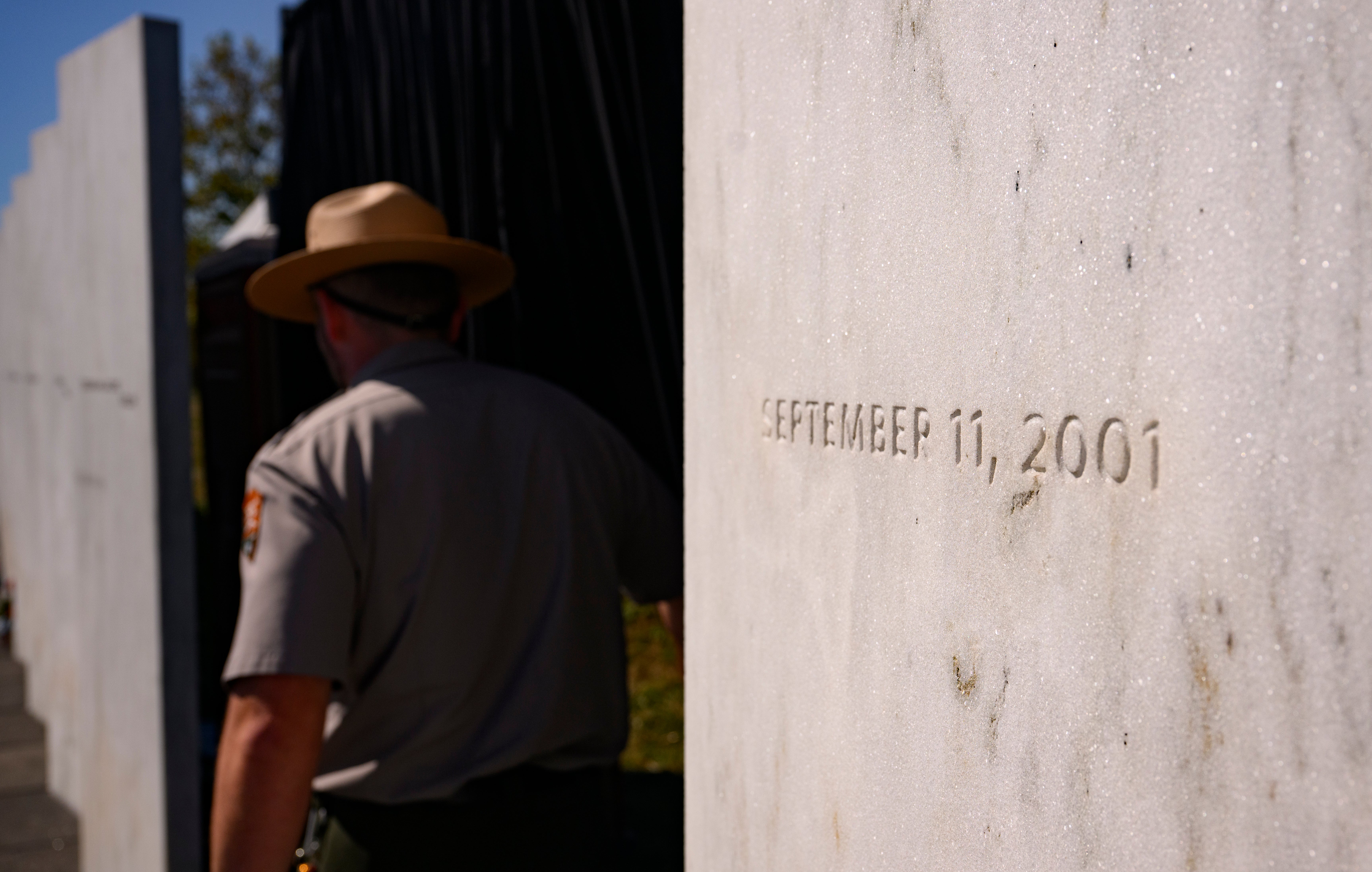A US Park Service Ranger stands at the Wall of Names following the memorial ceremony at the Flight 93 National Memorial