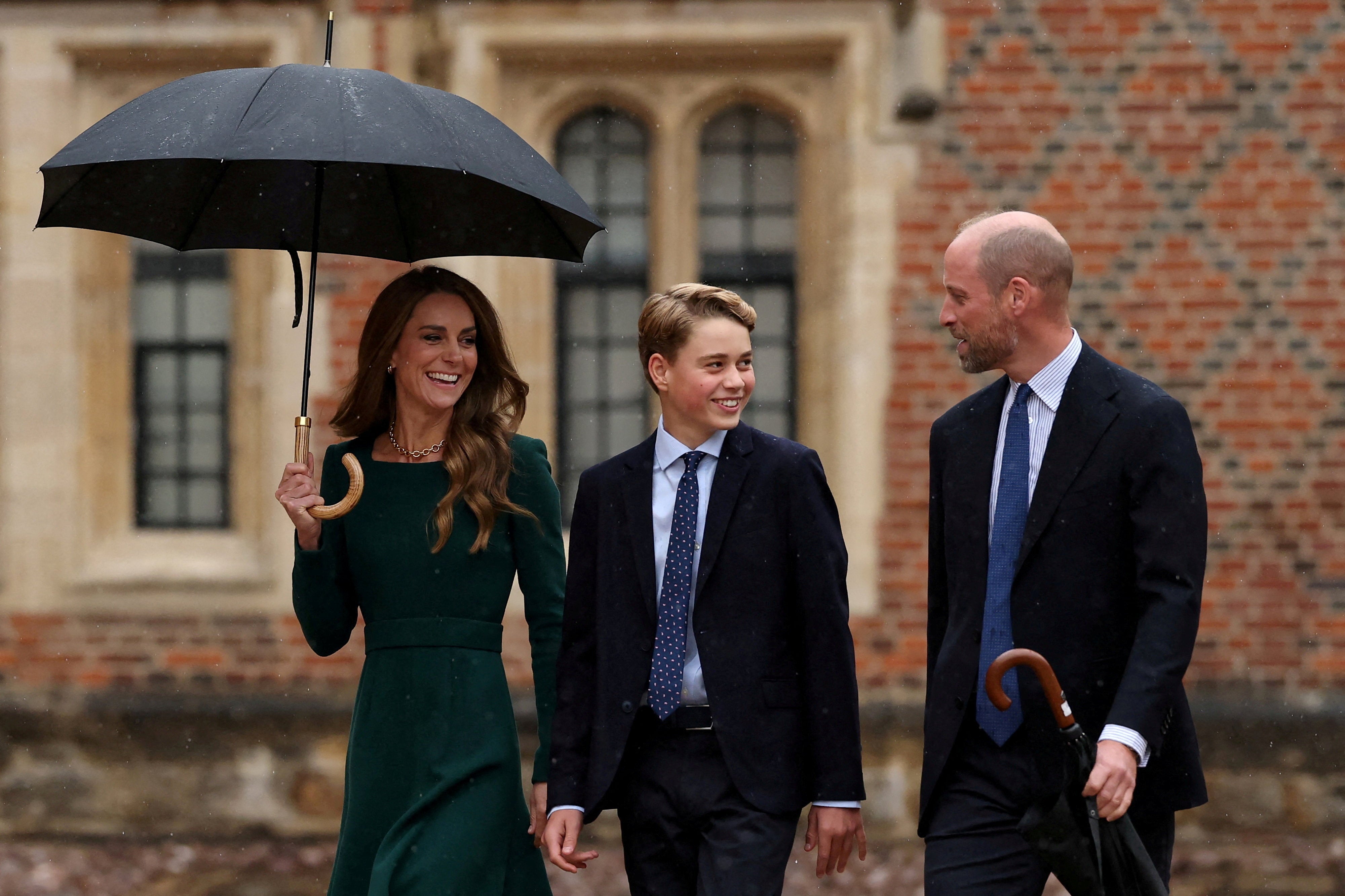 Princess Catherine and Prince William walk with their son, Prince George, as he arrives for his first day at Eton College