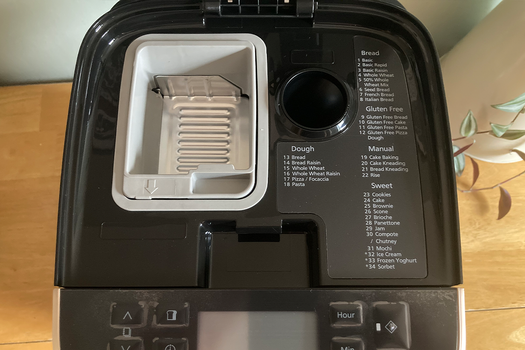 The yeast and nut dispensers will add the ingredients automatically during the baking process (Angharad Moran/The Independent)