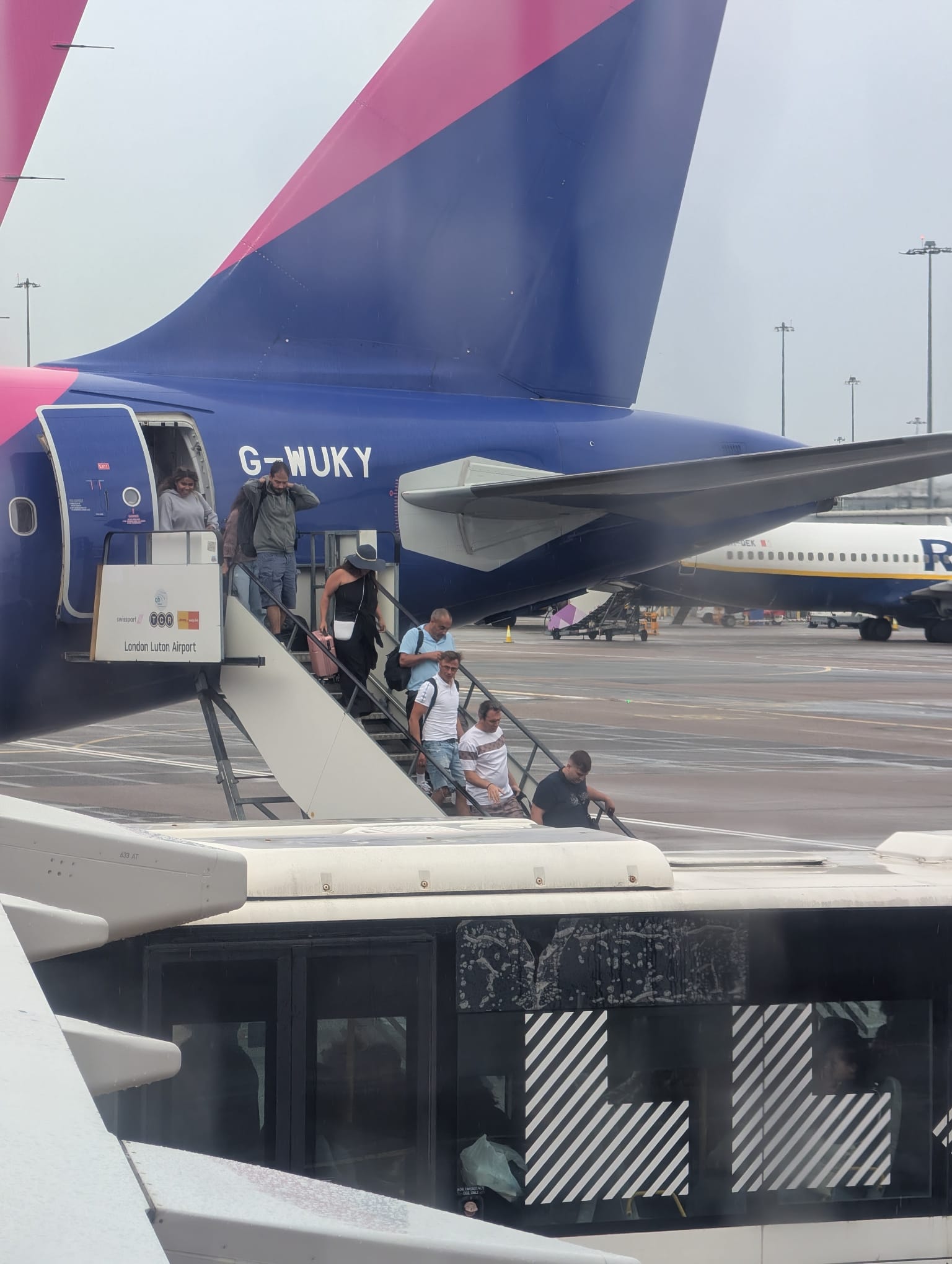 Passengers are leaving the tarmac at London Luton