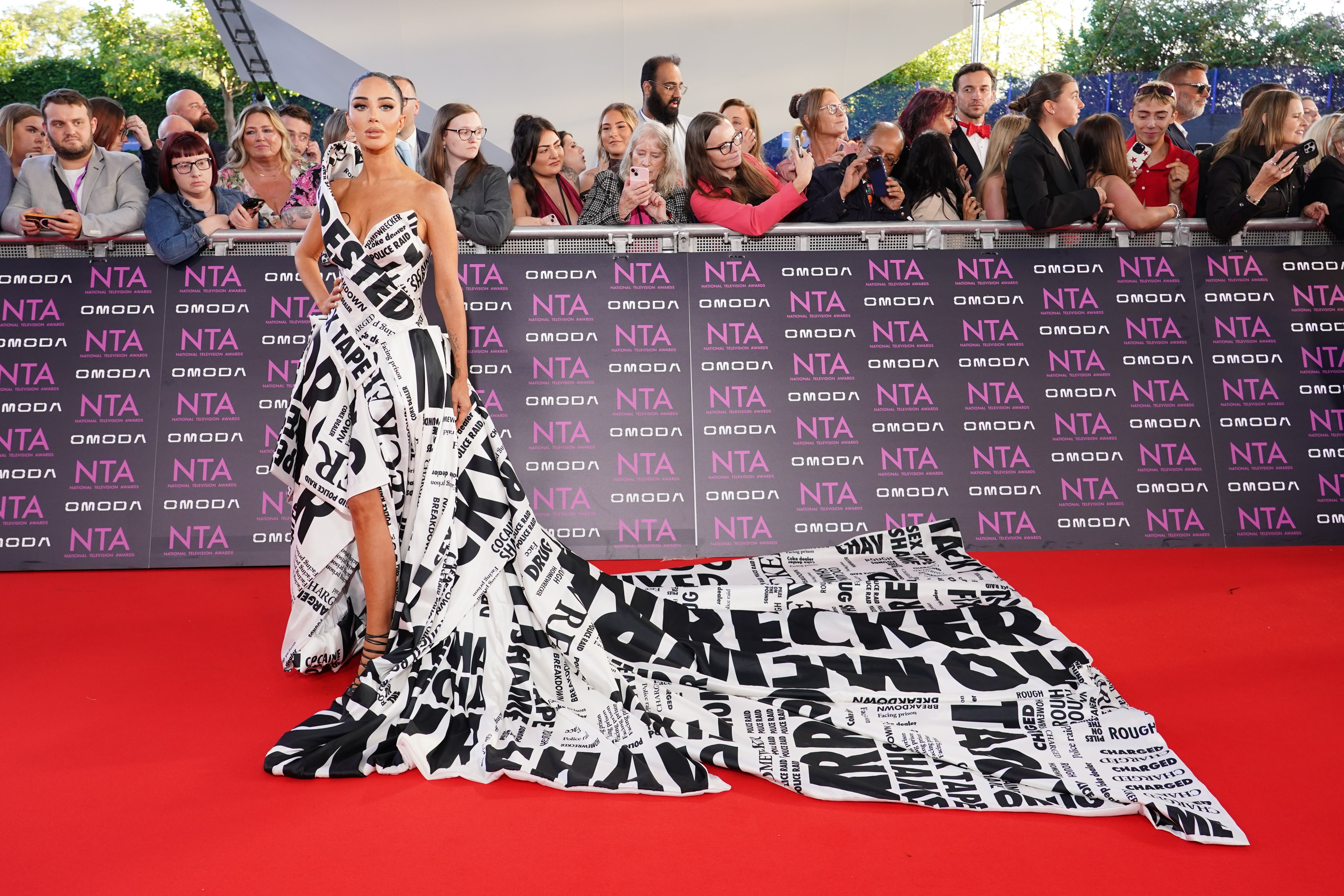 Tulisa shows off gown covered in headlines from drug sting scandal on NTA red carpet