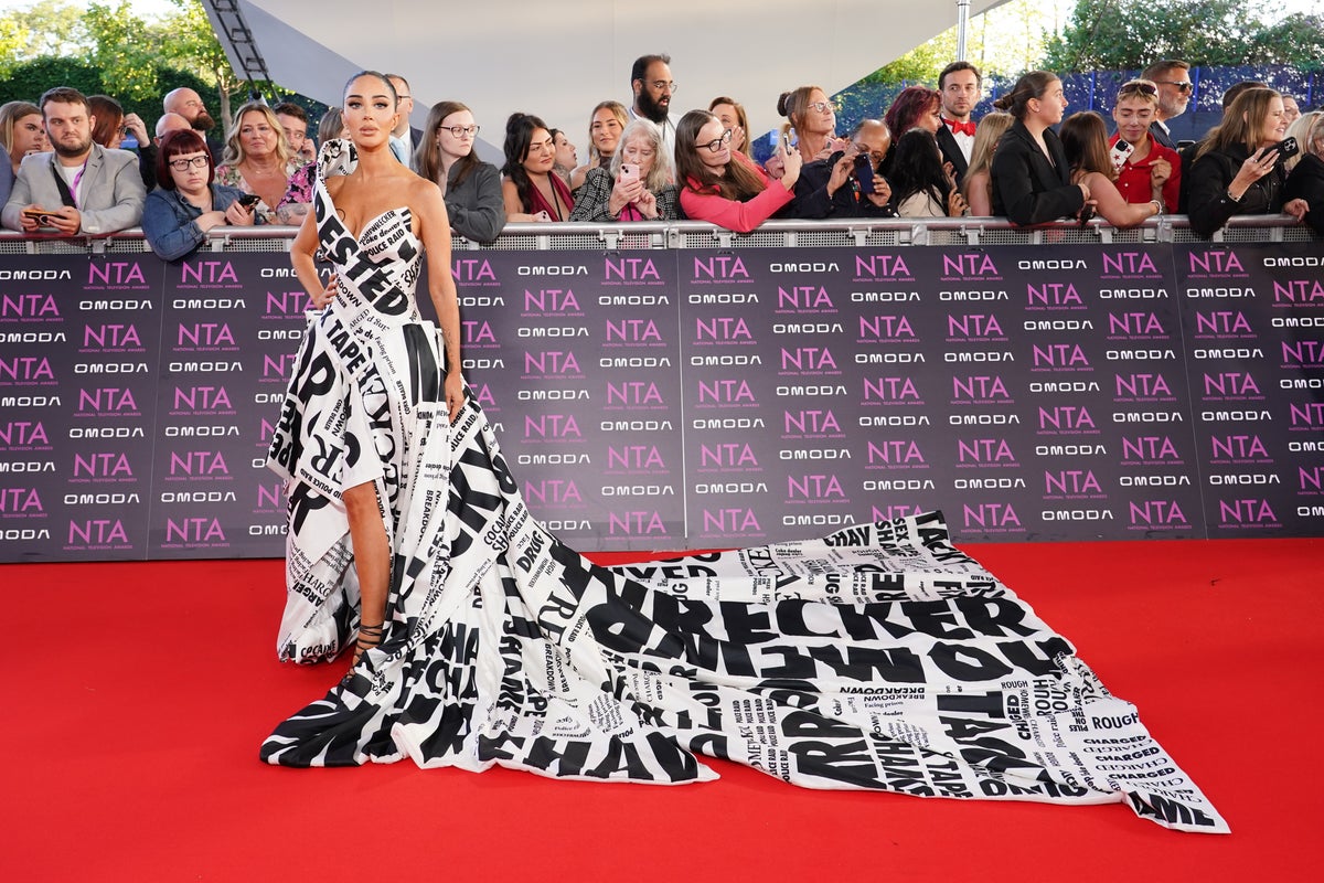 Tulisa shows off gown covered in headlines from drug sting scandal on NTA red carpet Tulisa shows off gown covered in headlines from drug sting scandal on NTA red carpet