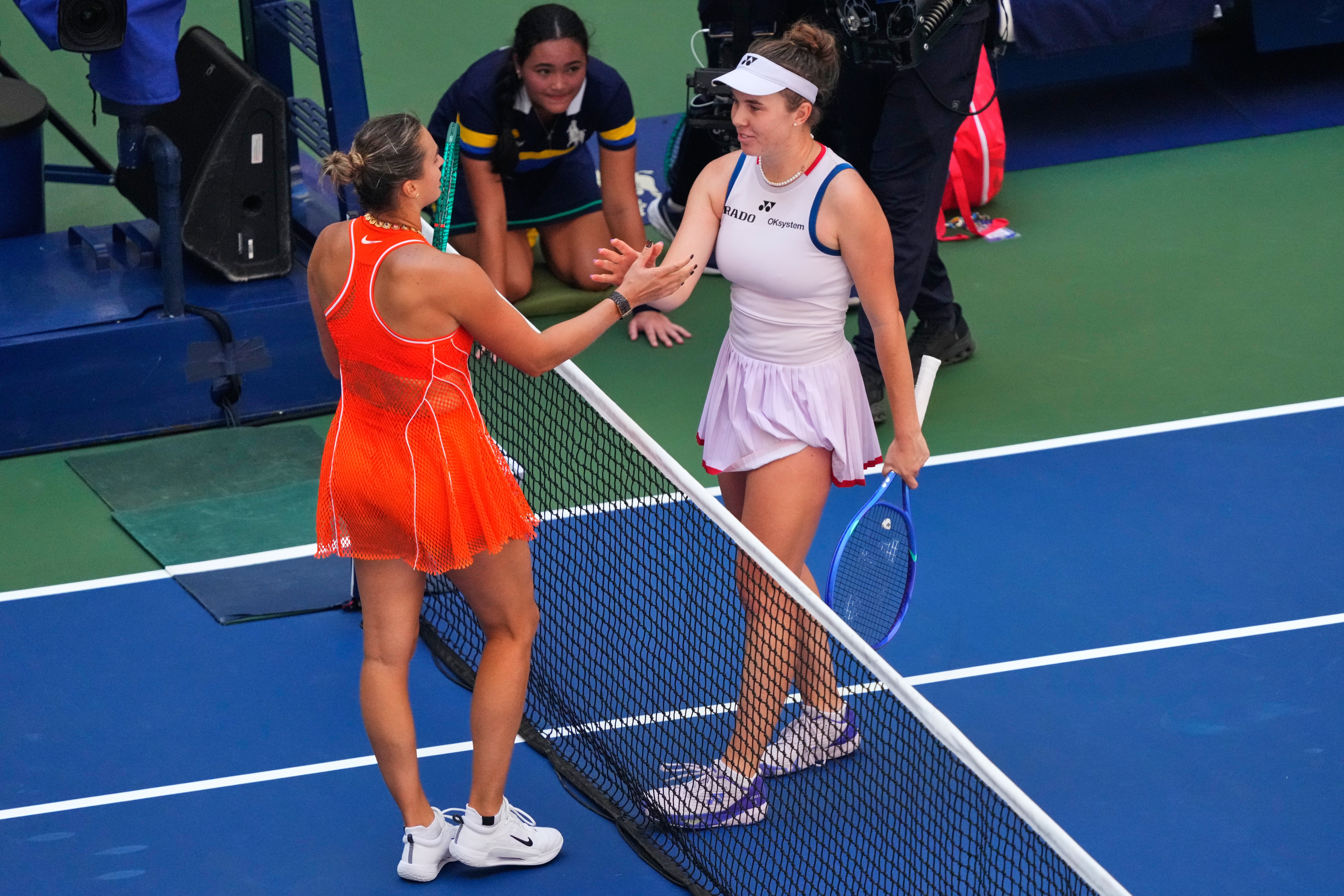 Aryna Sabalenka, left, and Linda Noskova embrace after a thrilling match (Yuki Iwamura/AP)
