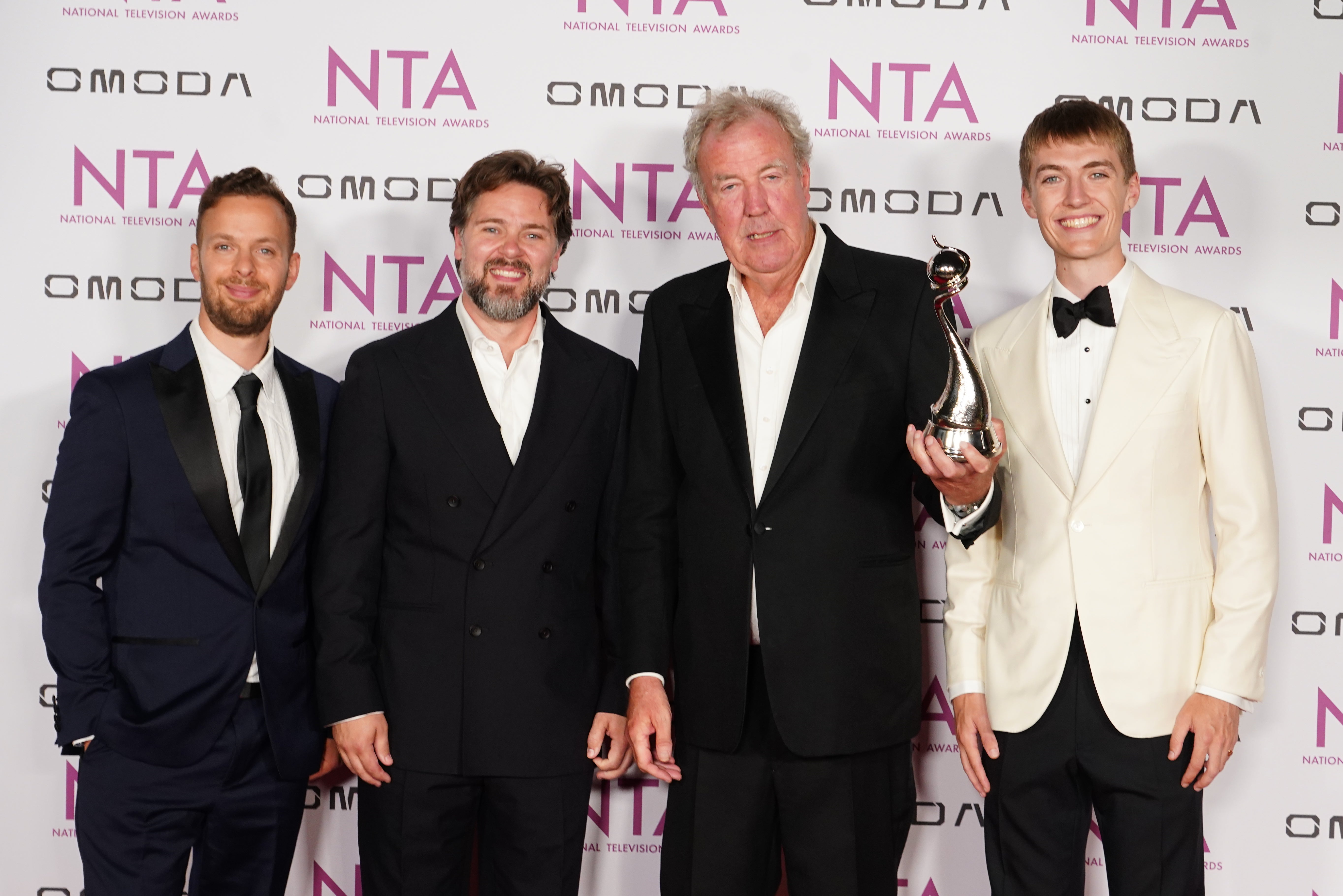 Jeremy Clarkson with award for Clarkson’s Farm the reality docuseries prize, with the new The Grand Tour presenters Francis Bourgeois (right), James Engelsman (left) and Thomas Holland (Ian West/PA)
