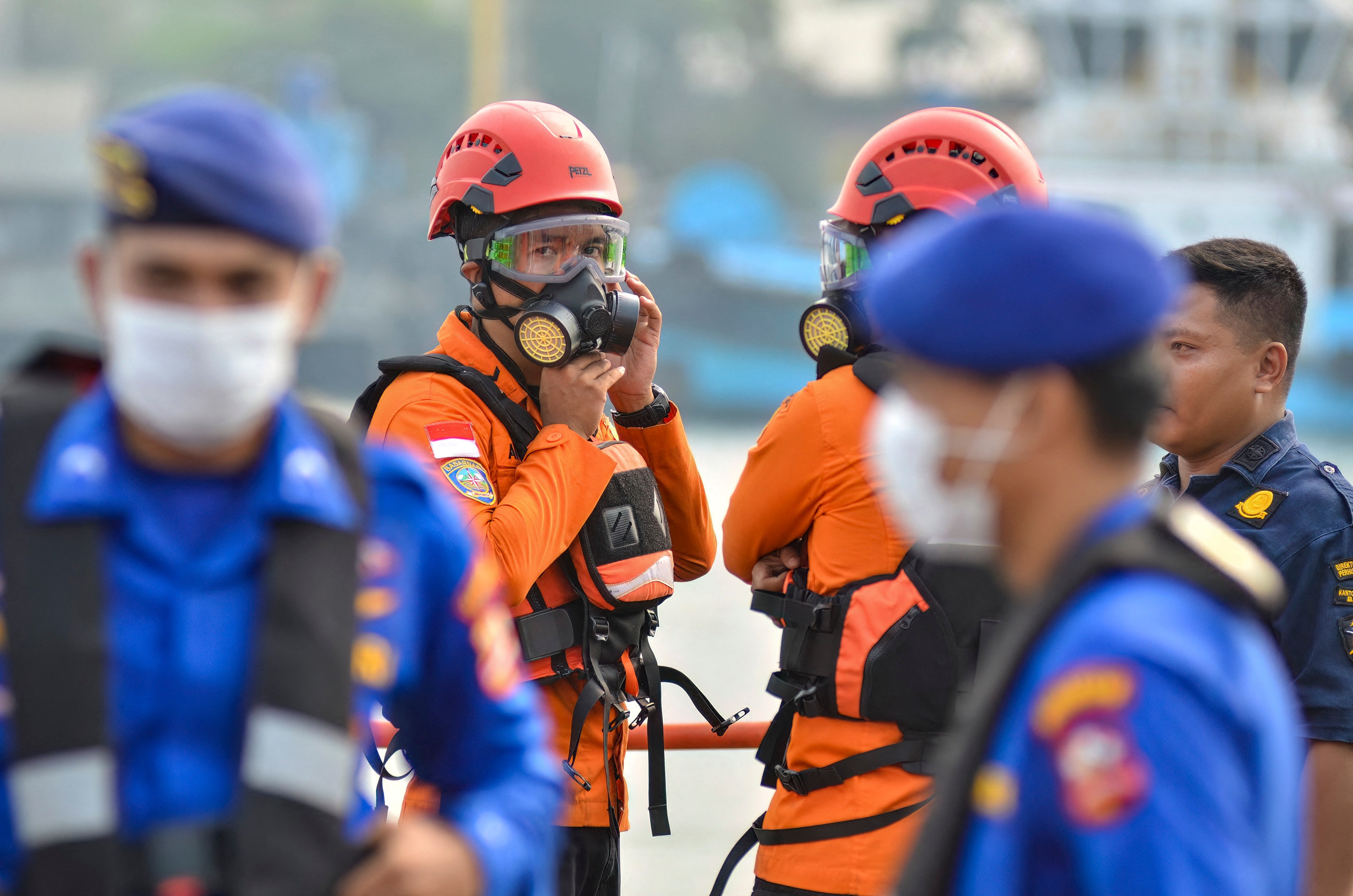 Officers from Banten Basarnas, wearing personal protective equipment, prepare alongside Water Police officers for the second day of the search operation, at Pelindo Regional 2 Port, in Cilegon, Banten, on 9 September 2026 (AFP/Getty)