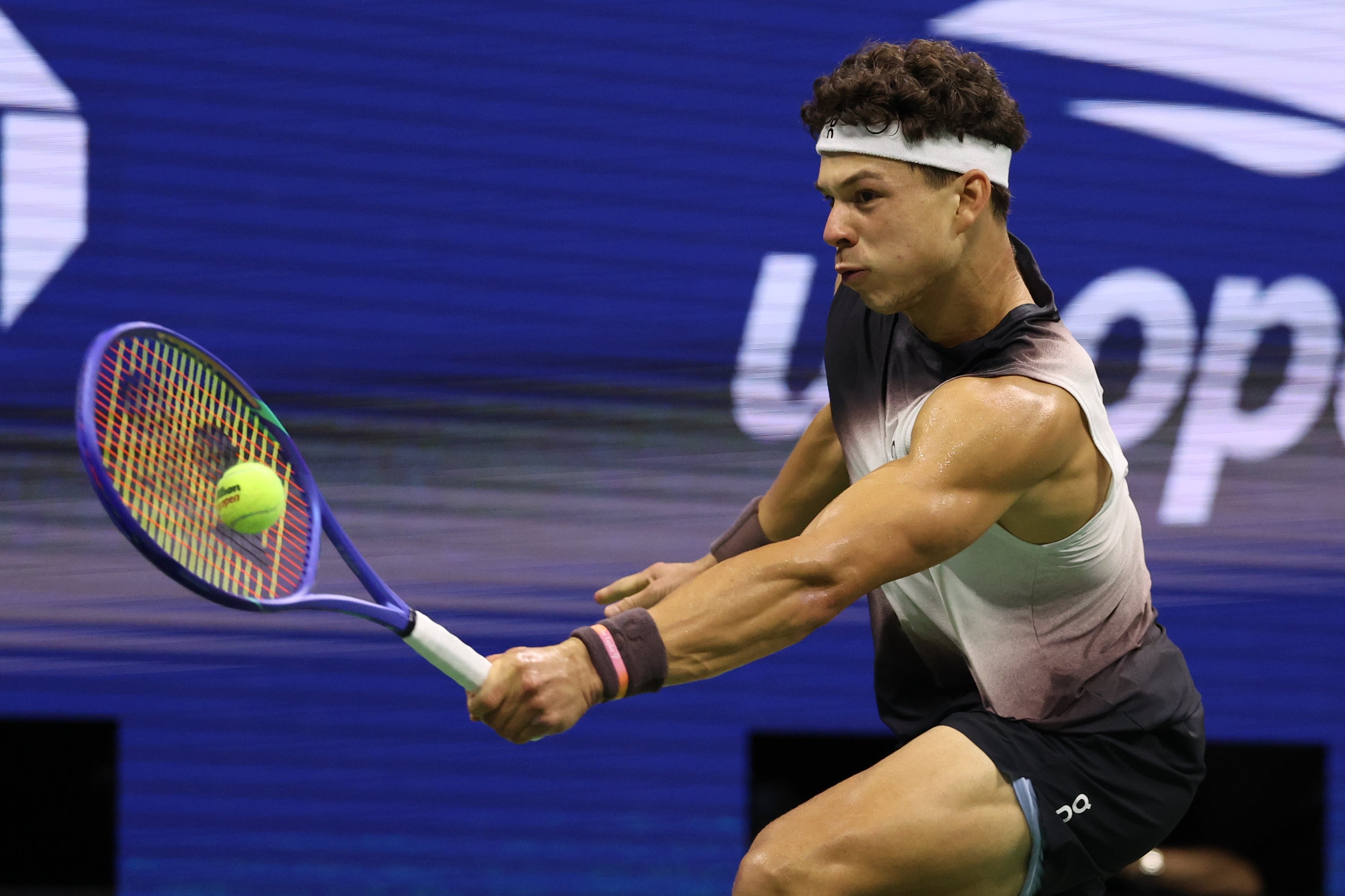 Ben Shelton, of the United States, hits a return against Carlos Alcaraz