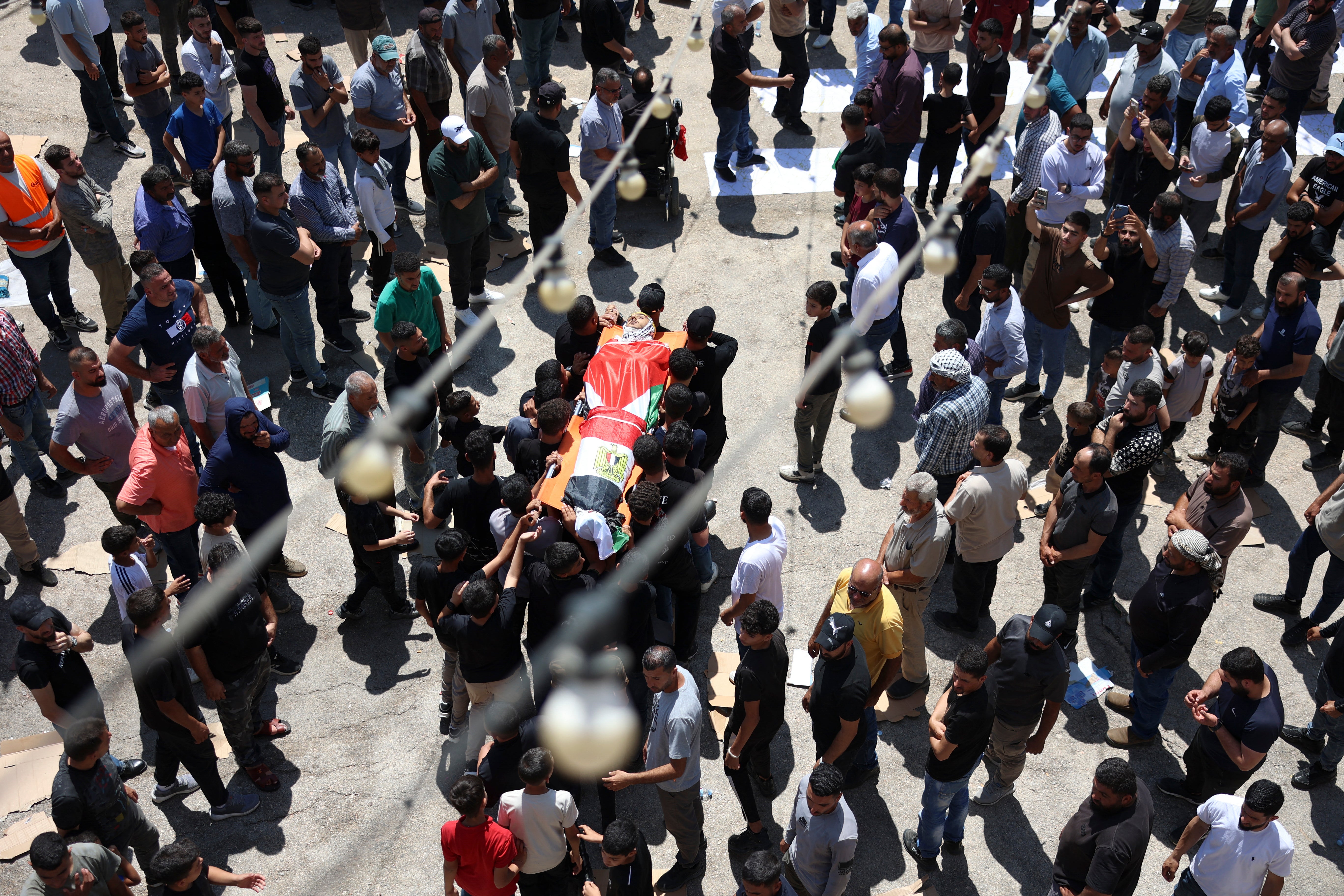 Palestinian mourners after two teenagers were killed in an act of settler violence (AFP/Getty)