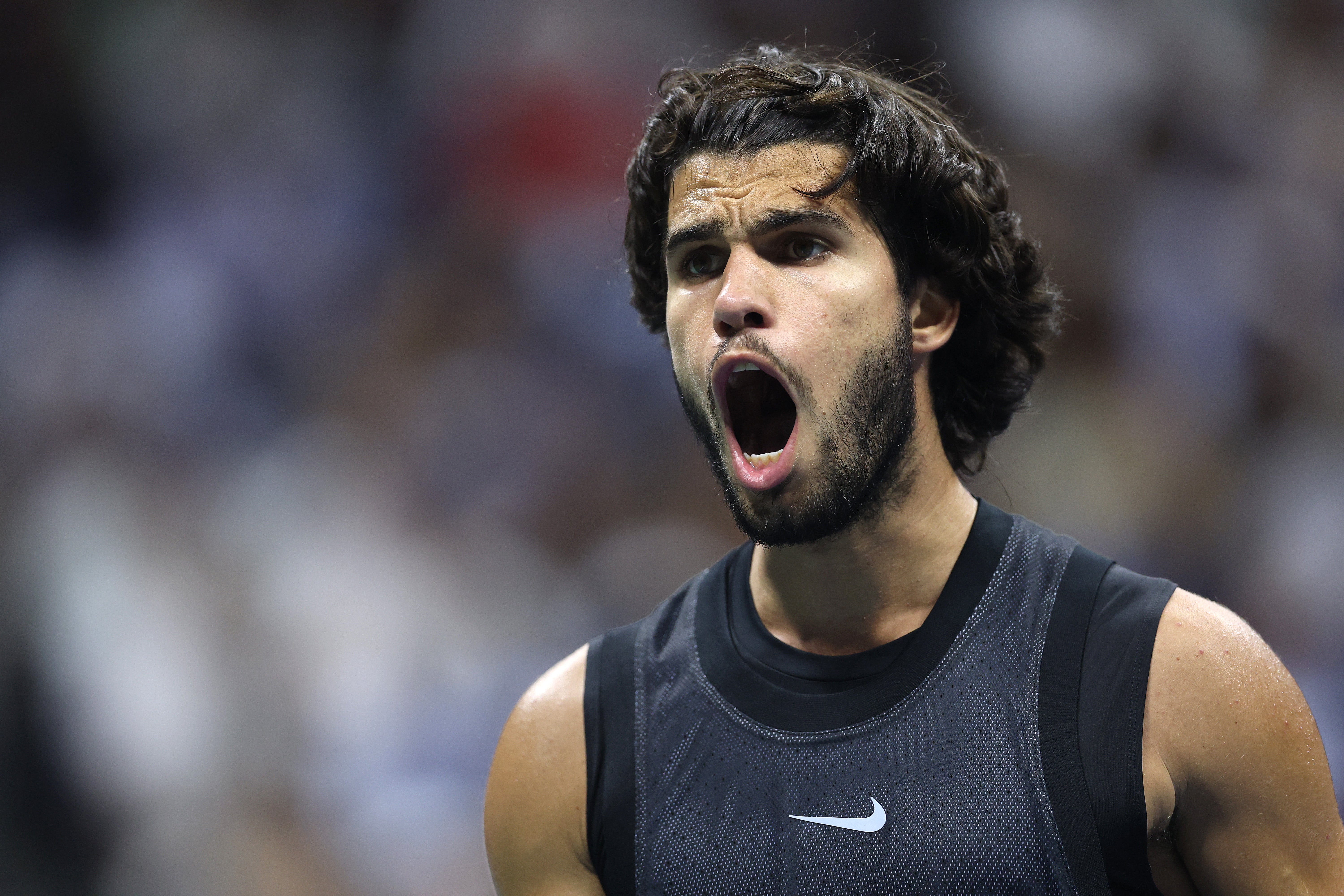 Carlos Alcaraz of Spain reacts against Ben Shelton of the United States