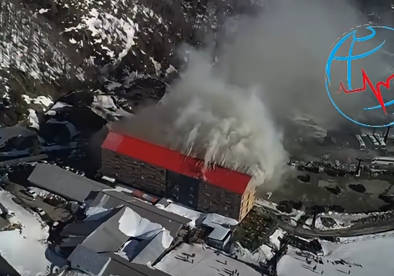 A huge plume of smoke rose from the hotel's roof before the fire spread to the surrounding area