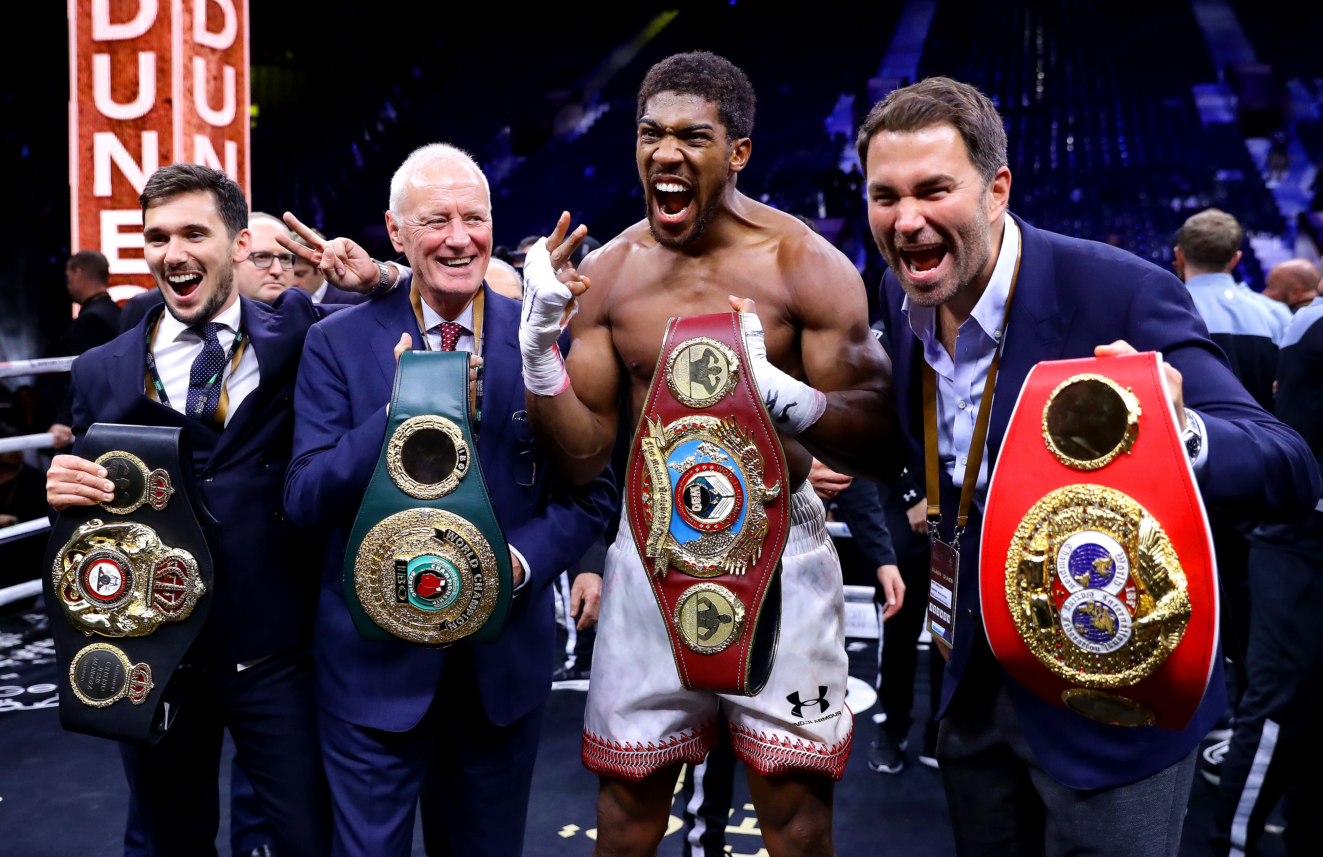 Barry Hearn (left) with his son Eddie (right) and Anthony Joshua