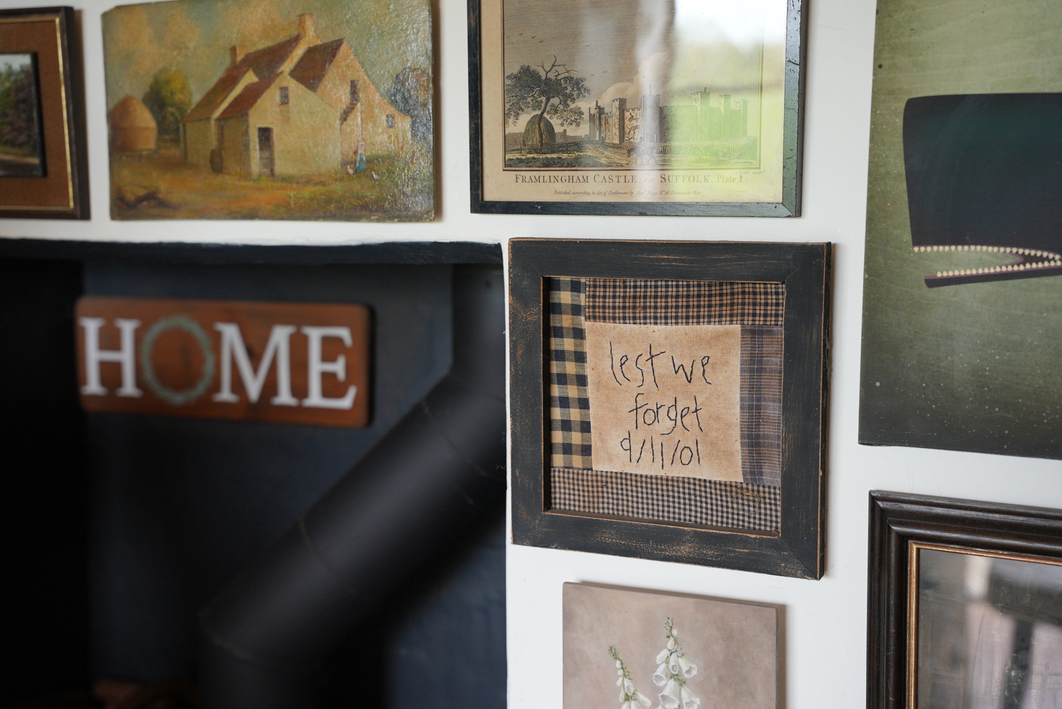 An embroidered artwork in Ms Brooks’ home in Harleston, Norfolk inscribed “Lest we forget 9/11/01”