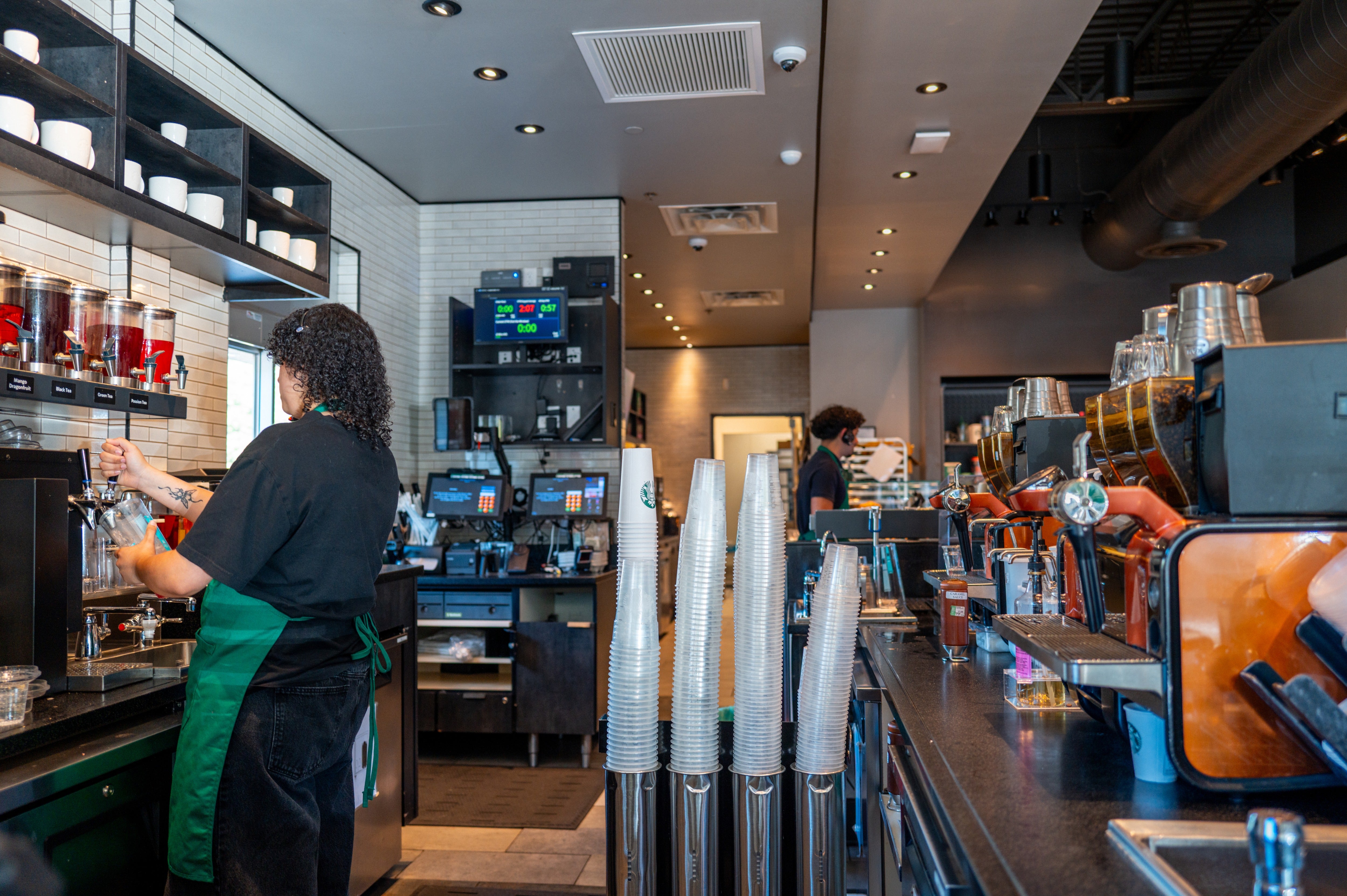 Starbucks has closed hundreds of stores, including its once-celebrated Seattle roastery, and cut jobs at its corporate offices