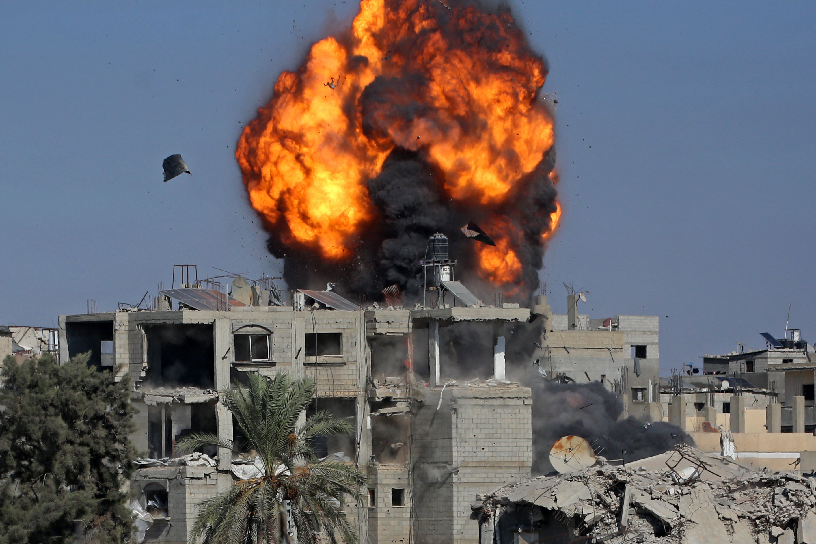Smoke and fire rises after a house was targeted by an Israeli strike in Khan Yunis, southern Gaza Strip, in September