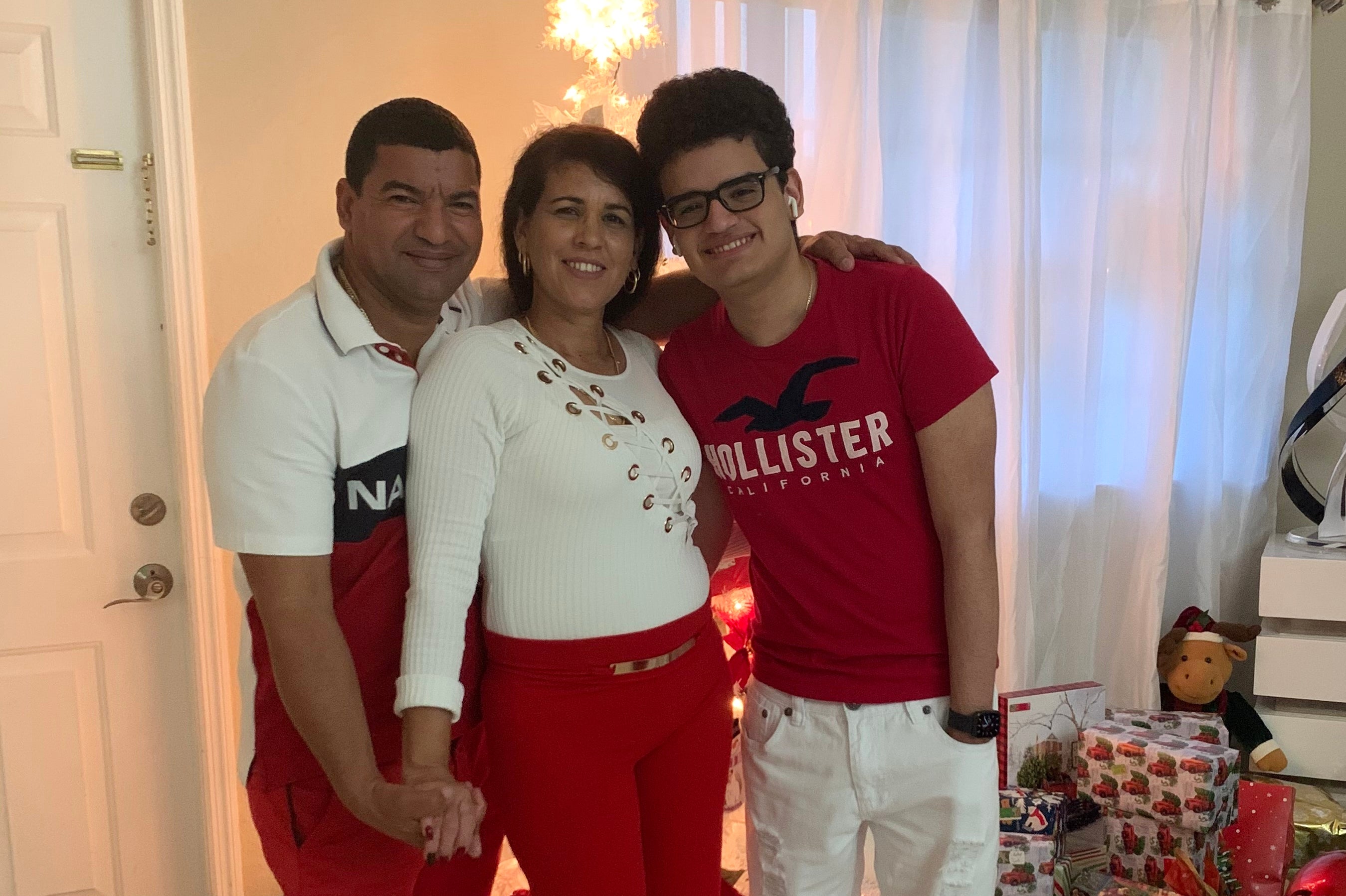 This undated photo provided by the family of Yoel Rodriguez Naranjo show him with his wife and son