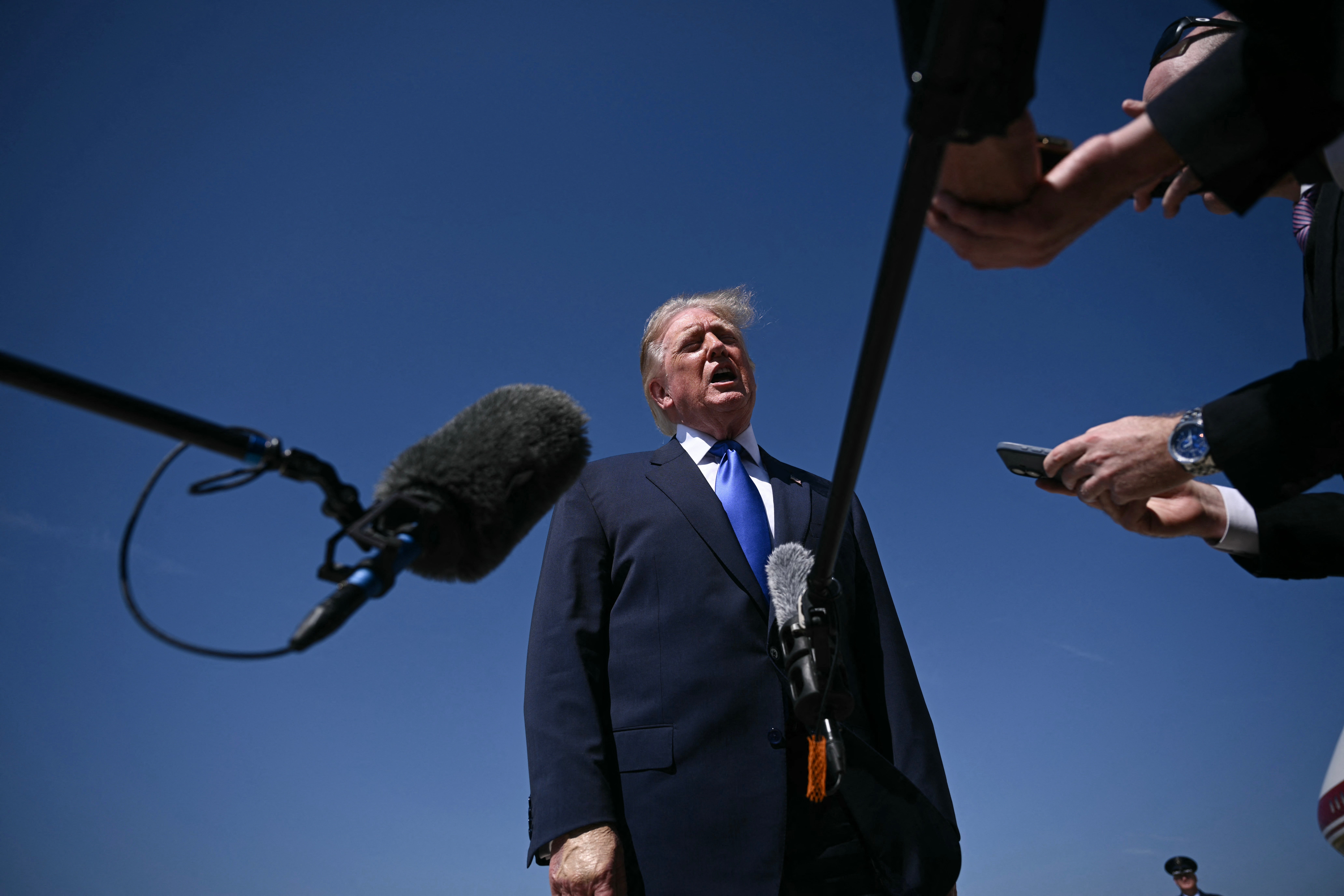Trump speaks to reporters before boarding Air Force One at Joint Base Andrews in Maryland on September 9