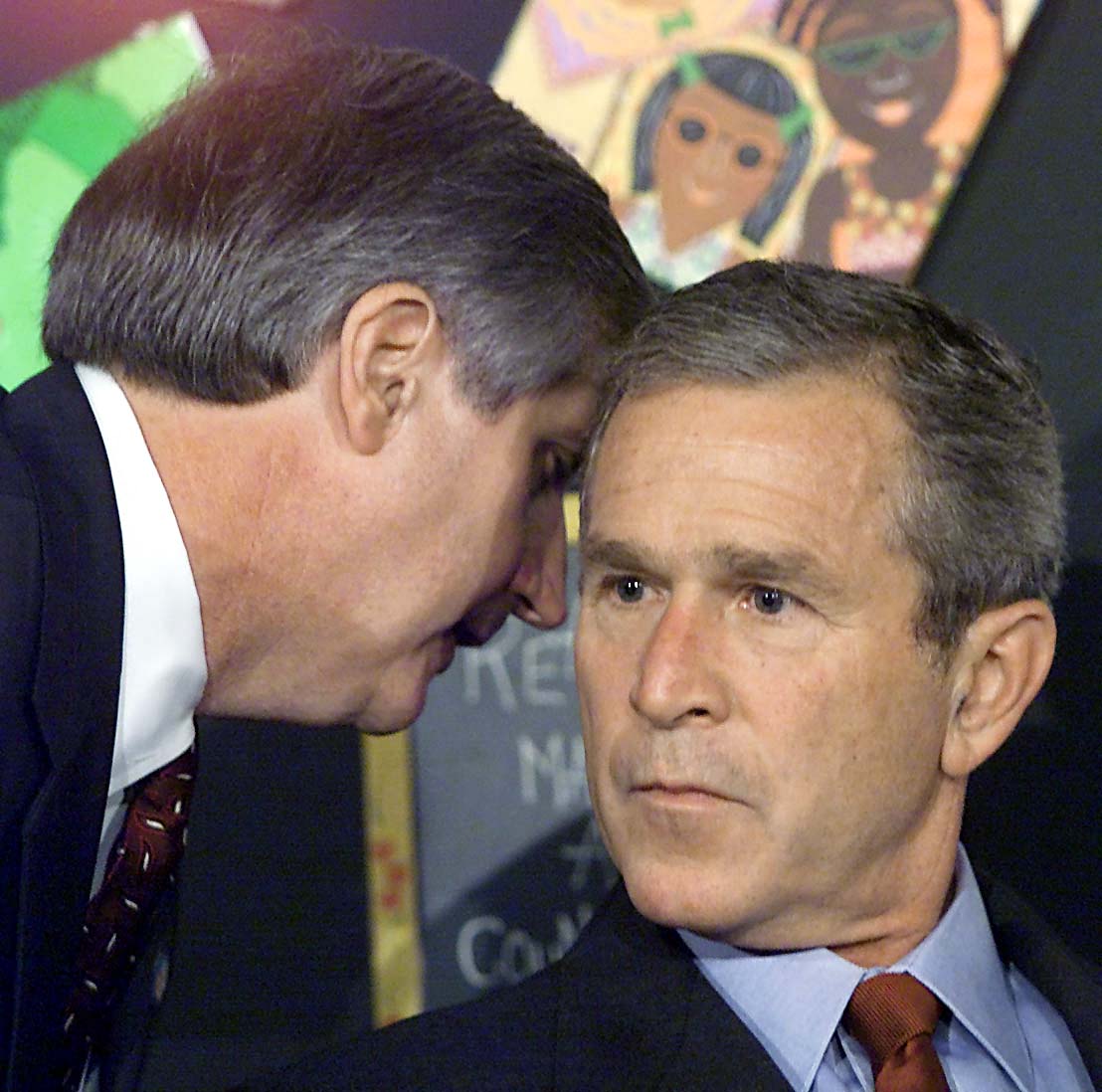 President George W. Bush at his early morning school reading event as he was interrupted by his Chief of Staff Andrew Card