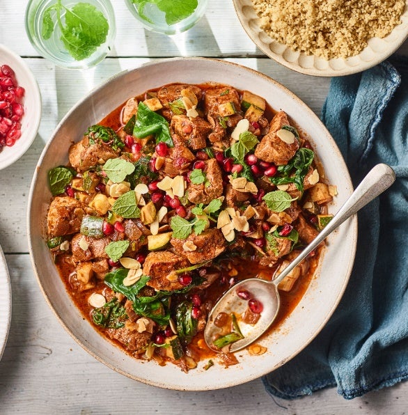 Chicken tagine with wholewheat couscous, almonds, pomegranate and plenty of herbs