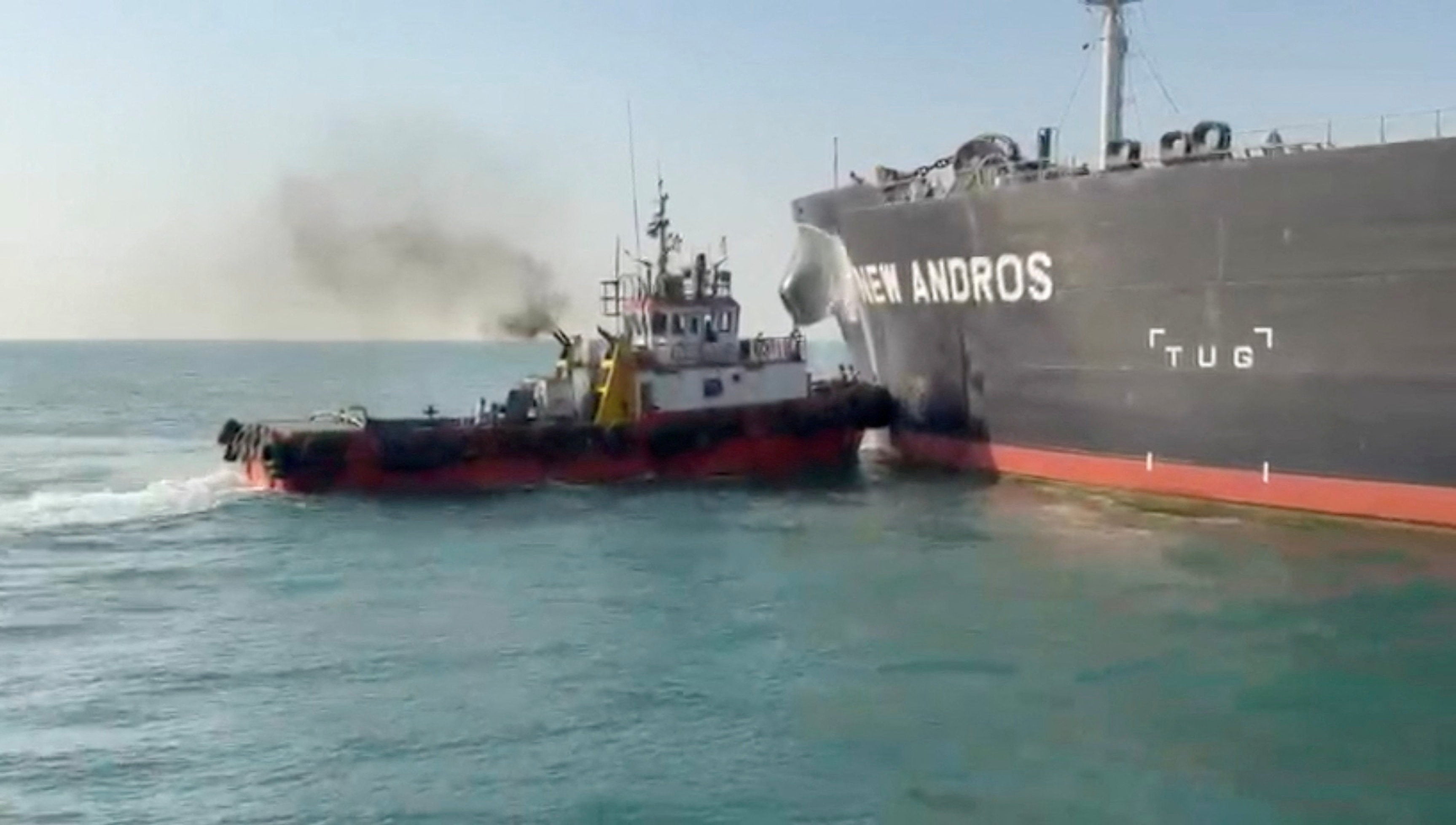 Water is sprayed on oil tanker New Andros, which according to port officials was struck by a drone in Iraqi territorial waters, at Sea, September 9,