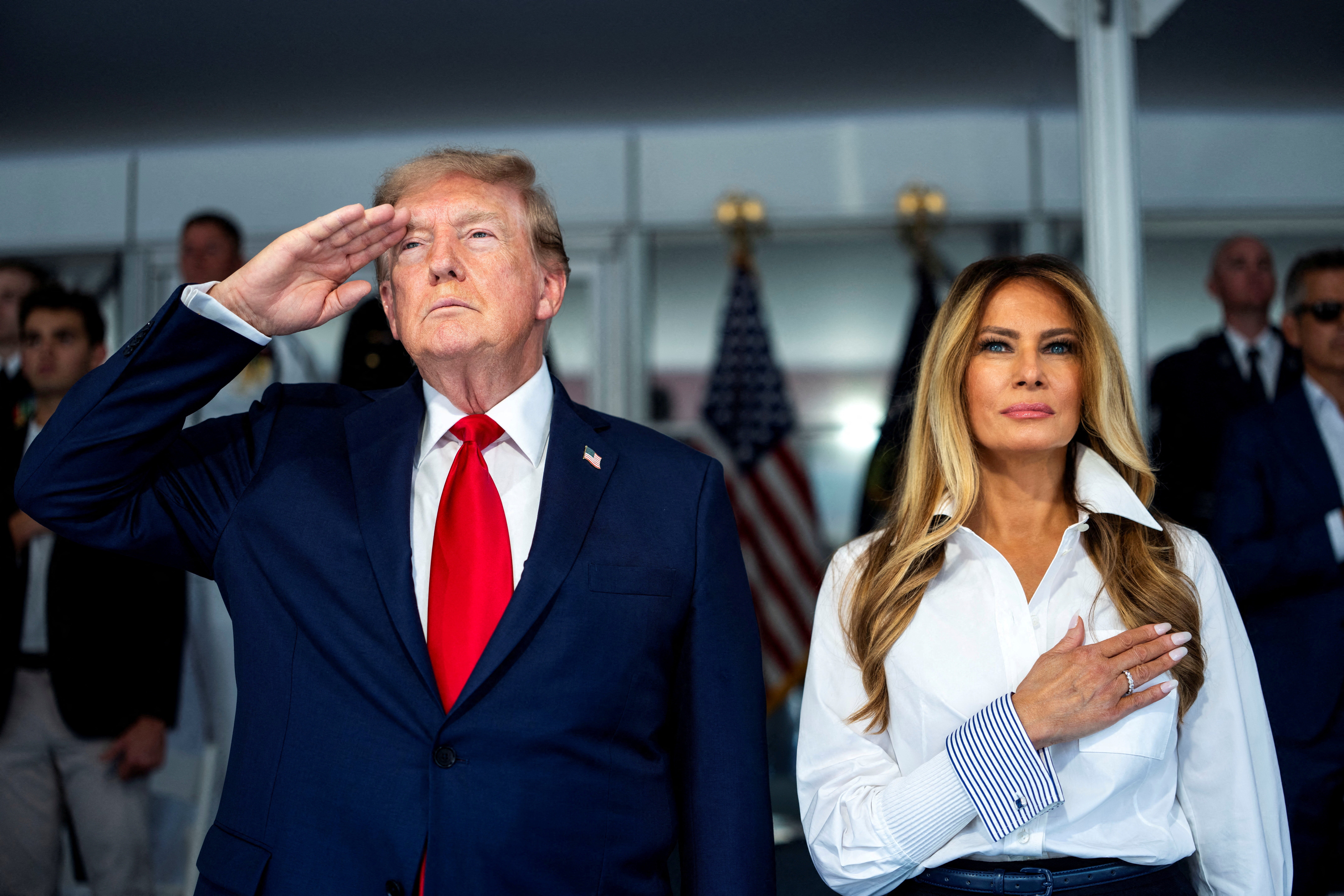 President Donald Trump with first lady Melania Trump during the National Anthem at the start of the Freedom 250 Grand Prix race on the streets of Washington, D.C.