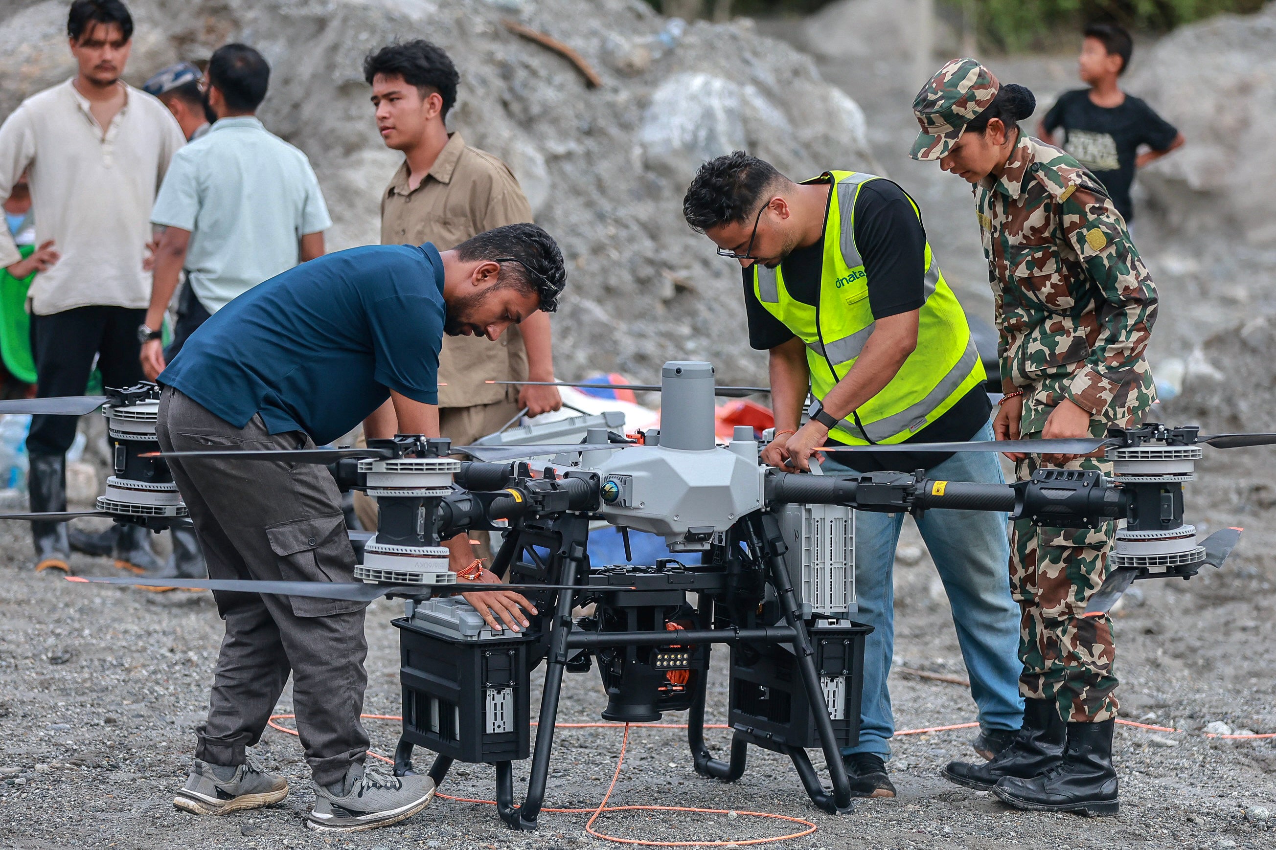 Technicians prepare a drone before it carries relief supplies to a flood-affected area in Trishuli in Nepal on 4 September 2026