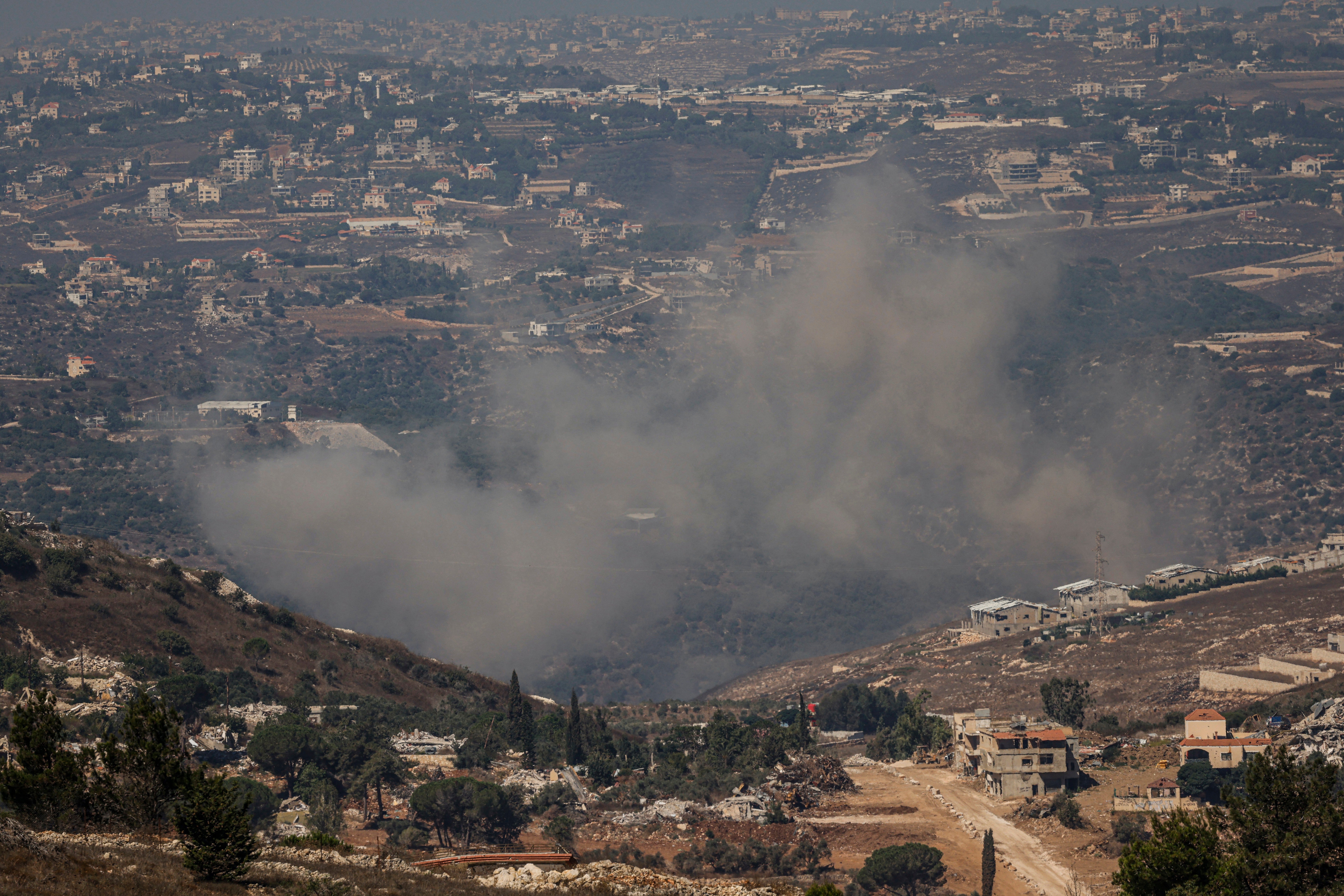 This picture taken from a position in Upper Galilee in northern Israel, near the border with Lebanon, shows smoke rising as the Israeli army exploded infrastructure