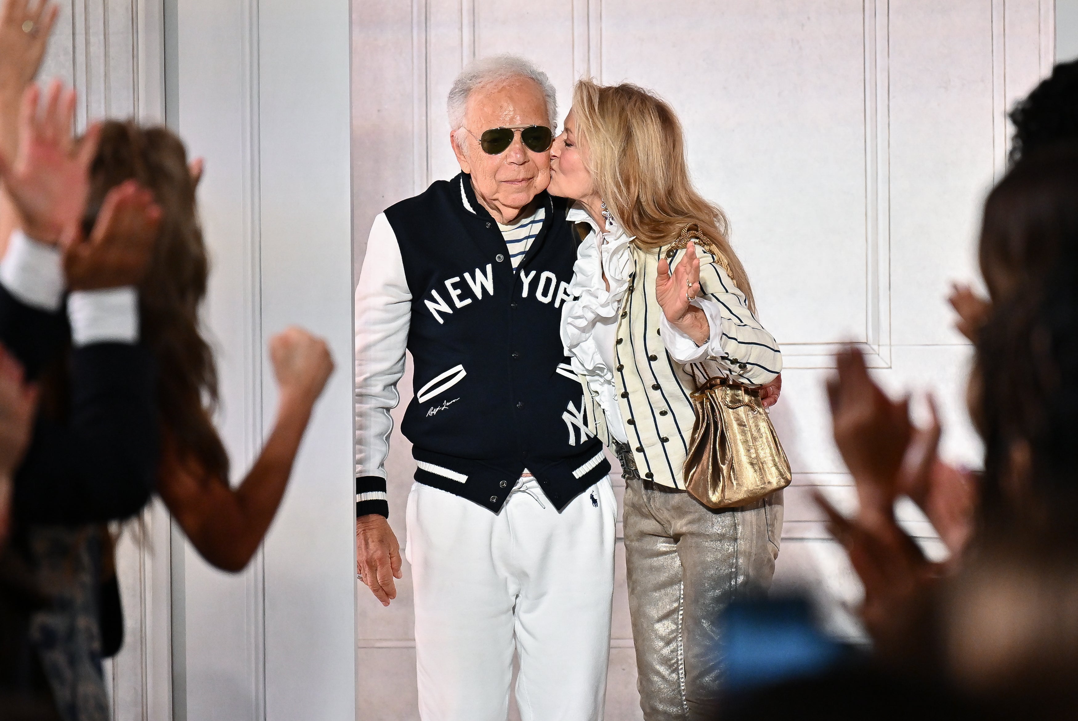 Ralph Lauren accepted applause at the end of the show with his wife, Ricky (Evan Agostini/AP)