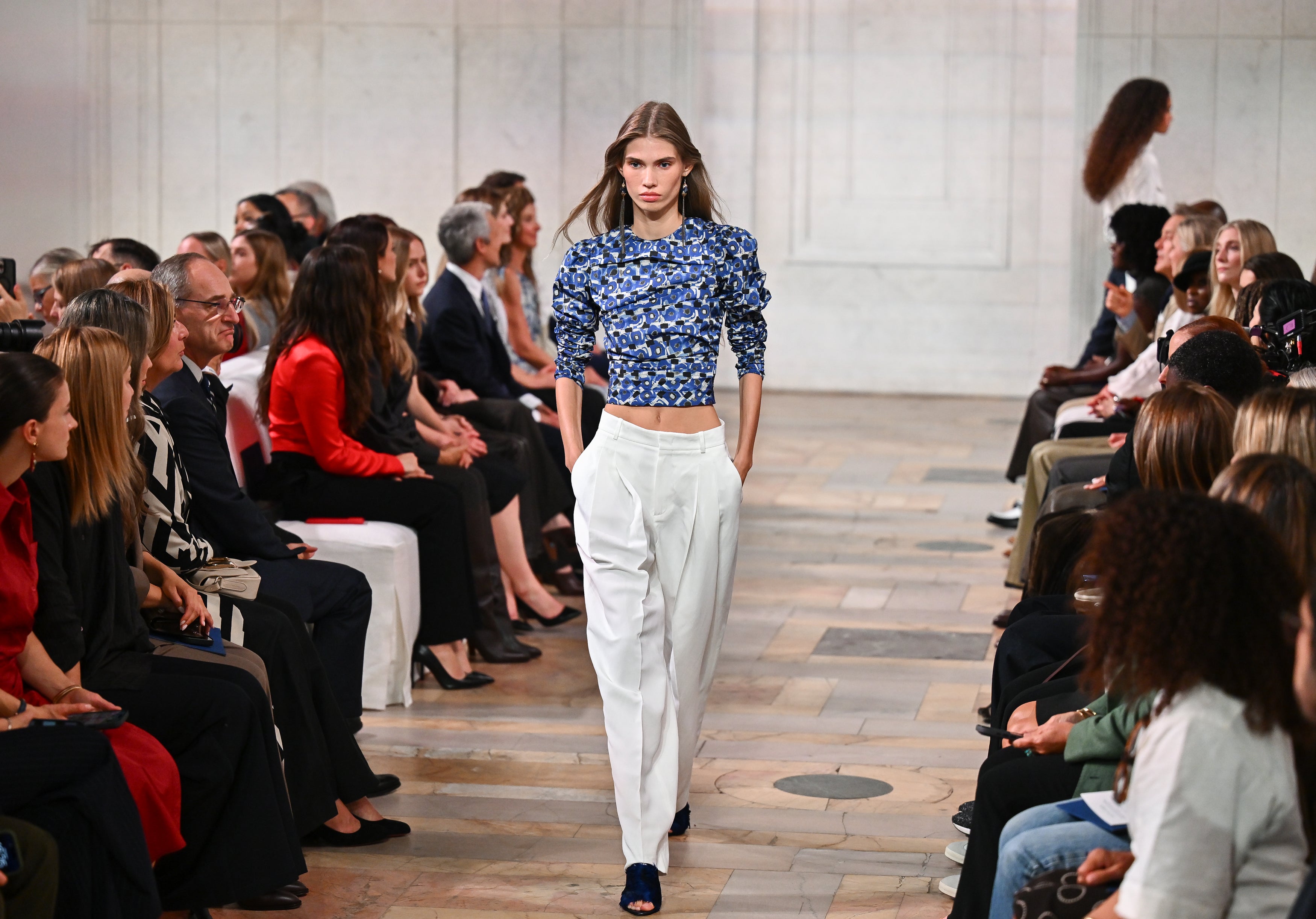 Eighties-inspired prints and crop tops were an unexpected addition to the collection (Evan Agostini/AP)