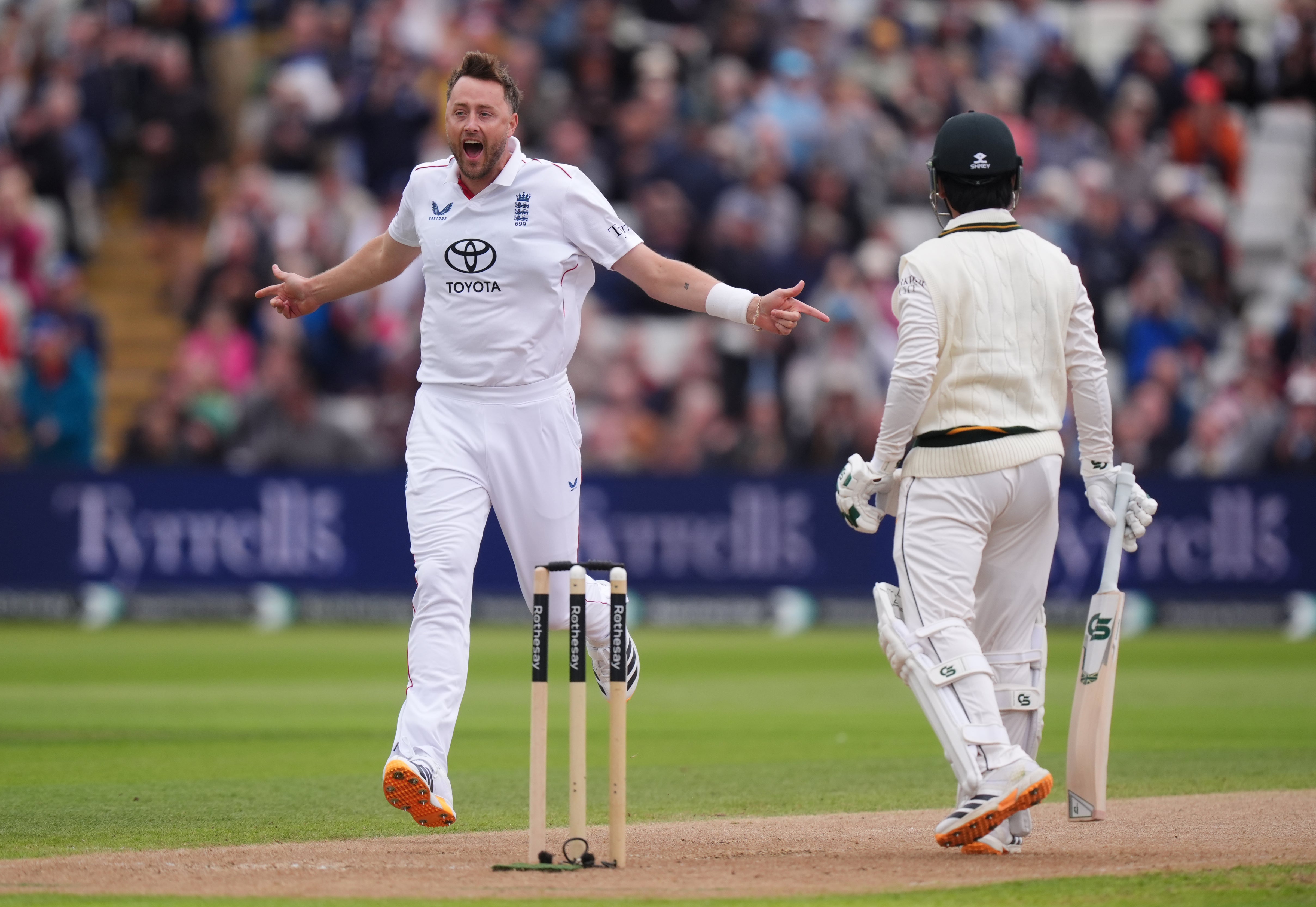Ollie Robinson celebrates the wicket of Saim Ayub (Mike Egerton/PA)