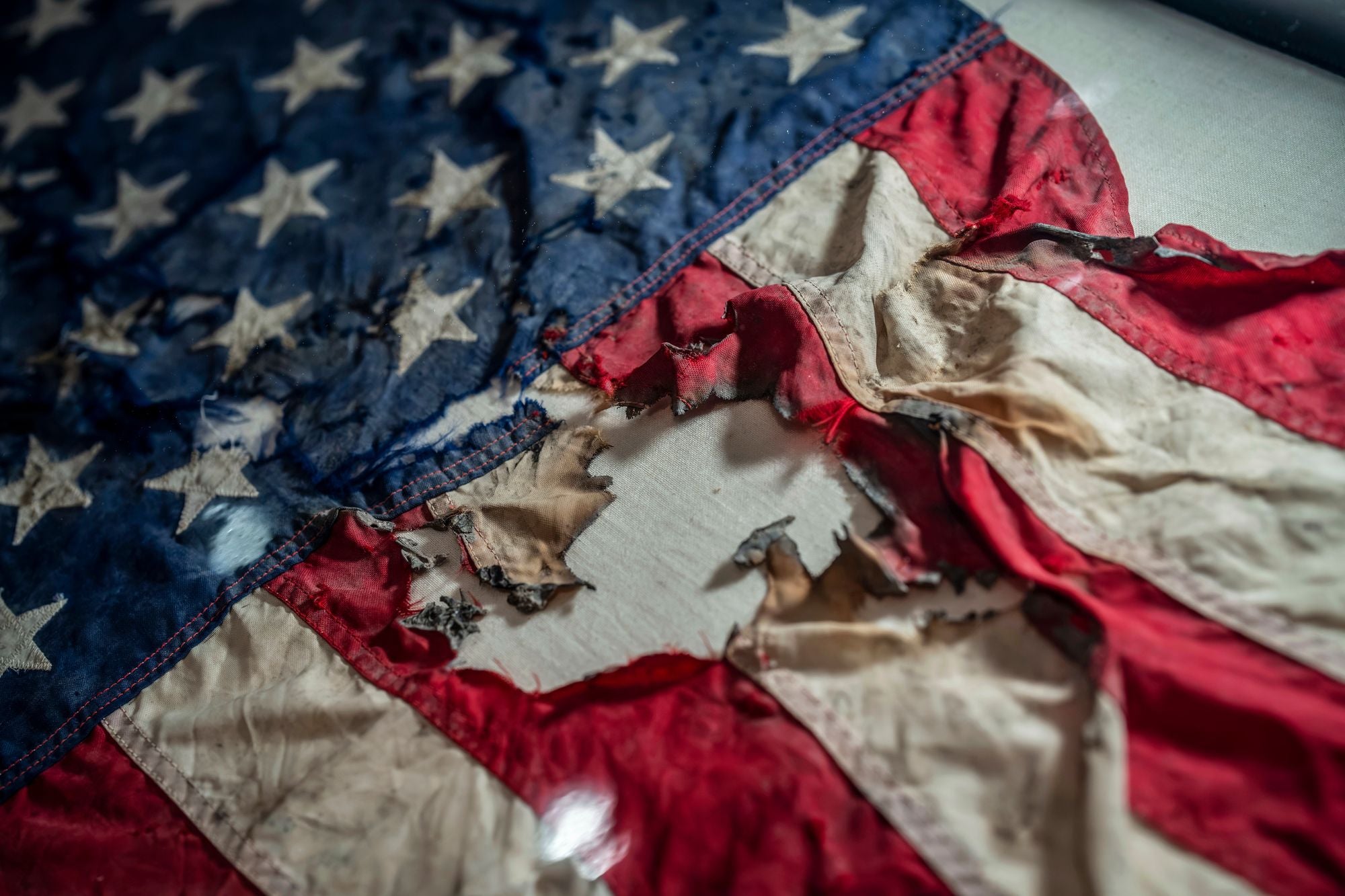 A badly damaged flag recovered from the World Trade Center debris