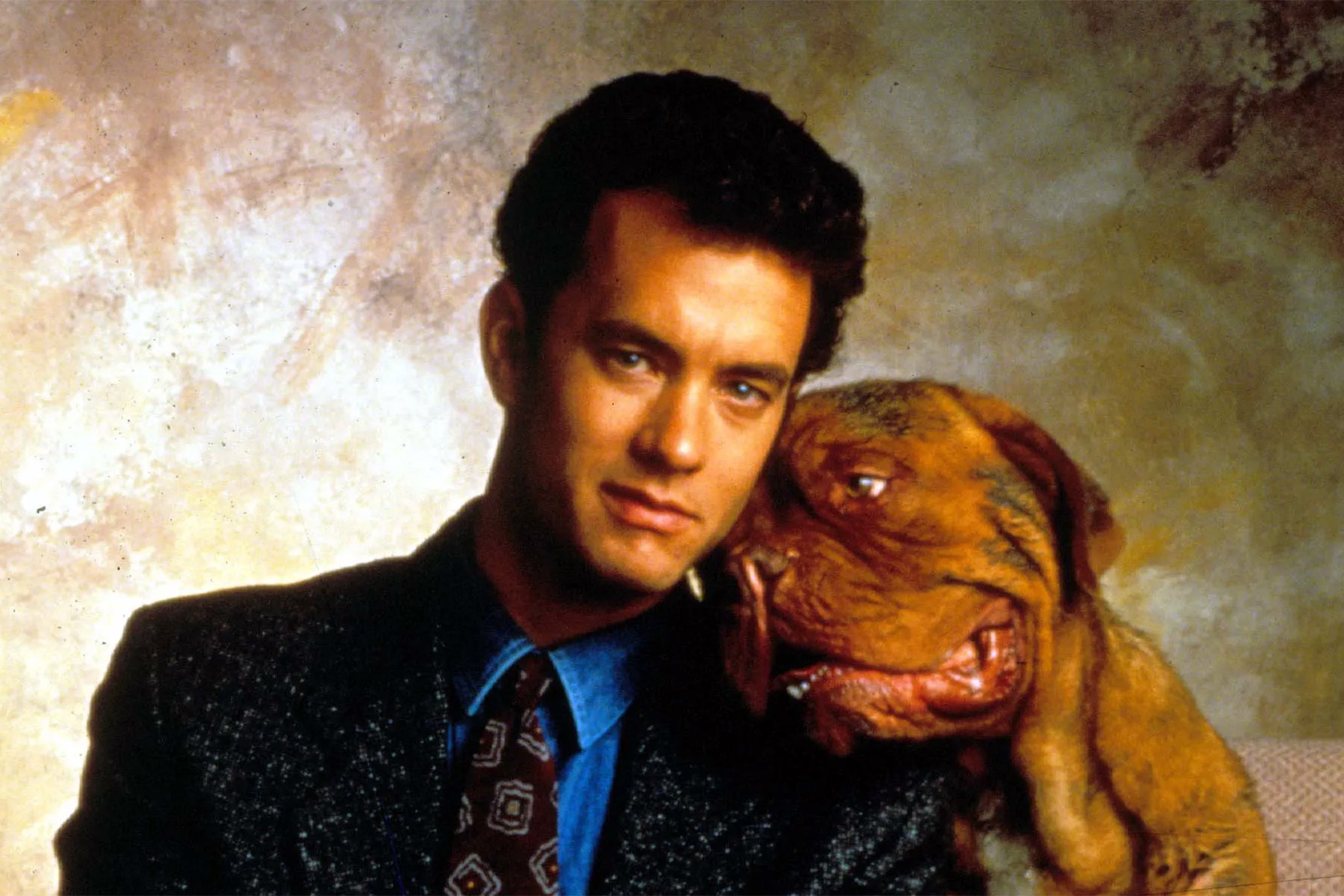 Hanks played a police detective who must adopt a rambunctious dog in order to help him find a killer in ‘Turner & Hooch’ (Disney)