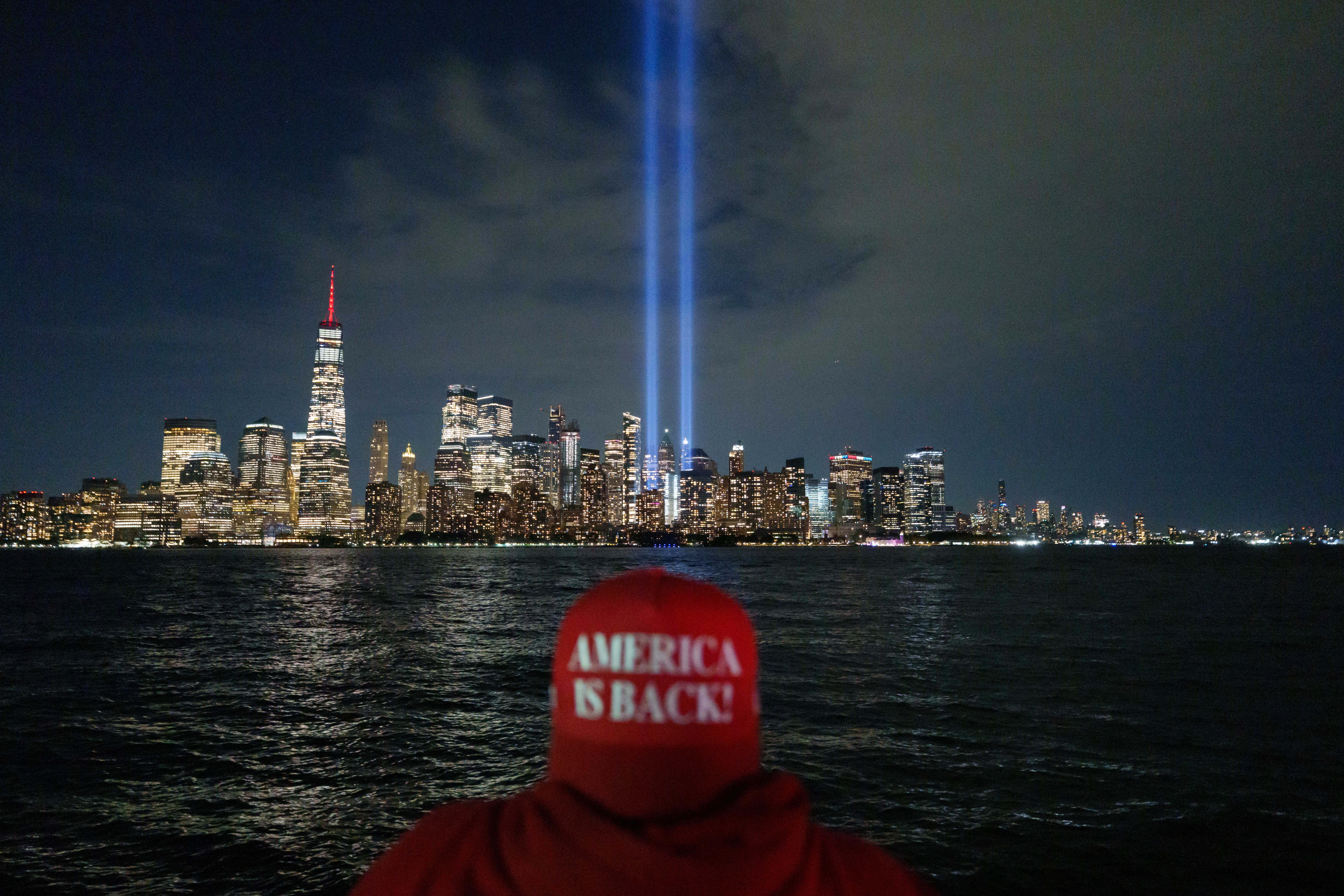Phillip Flood, 48, watches as the Tribute in Light is tested over the skyline of lower Manhattan (AP)