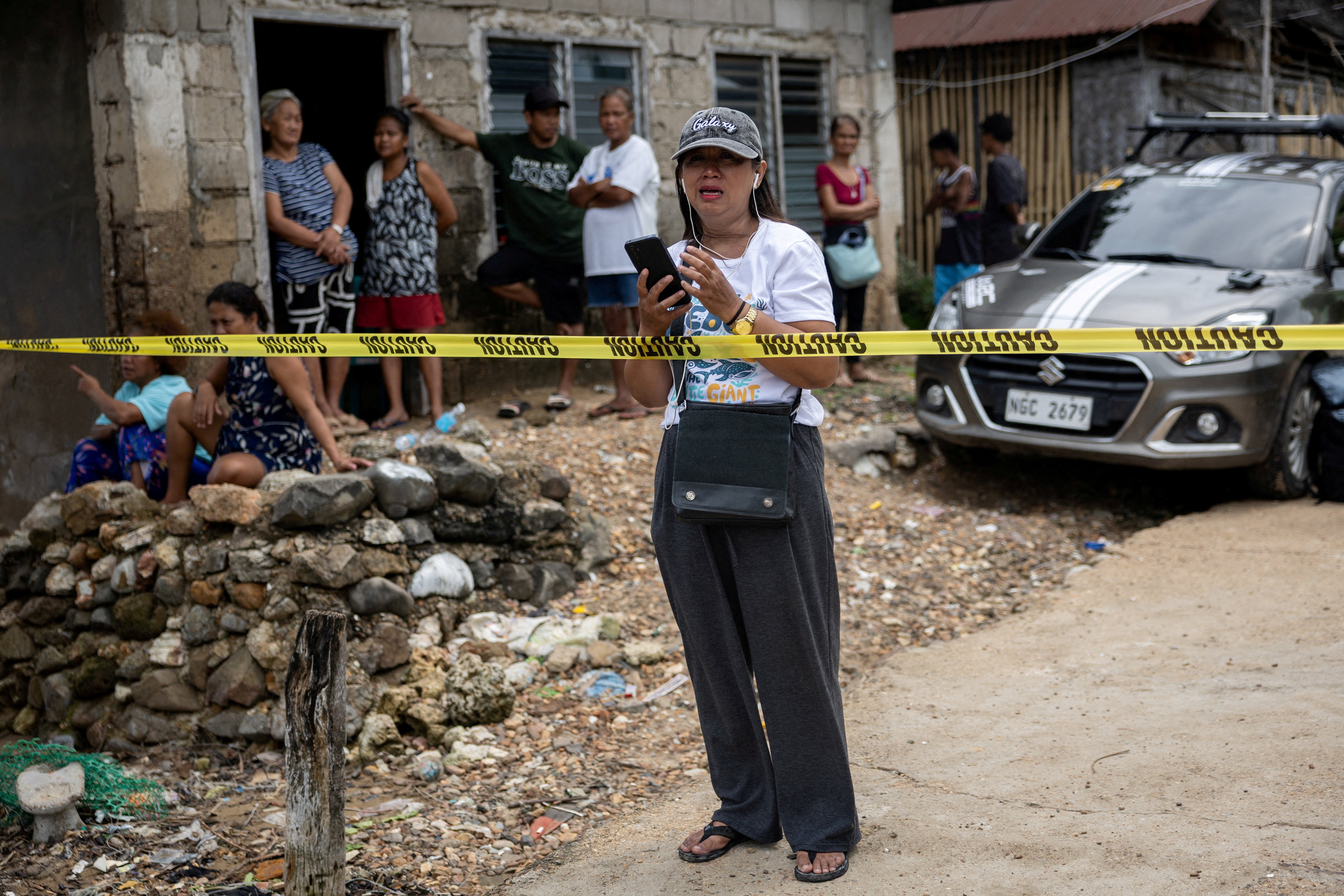 Janelle Navawa, 48, cries while speaking to a relative on the phone as she waits for information about family members who are among those missing following a fire aboard the MV June Aster ferry off the coast of Palawan, in Coron, Philippines, 11 September 2026 (Reuters)