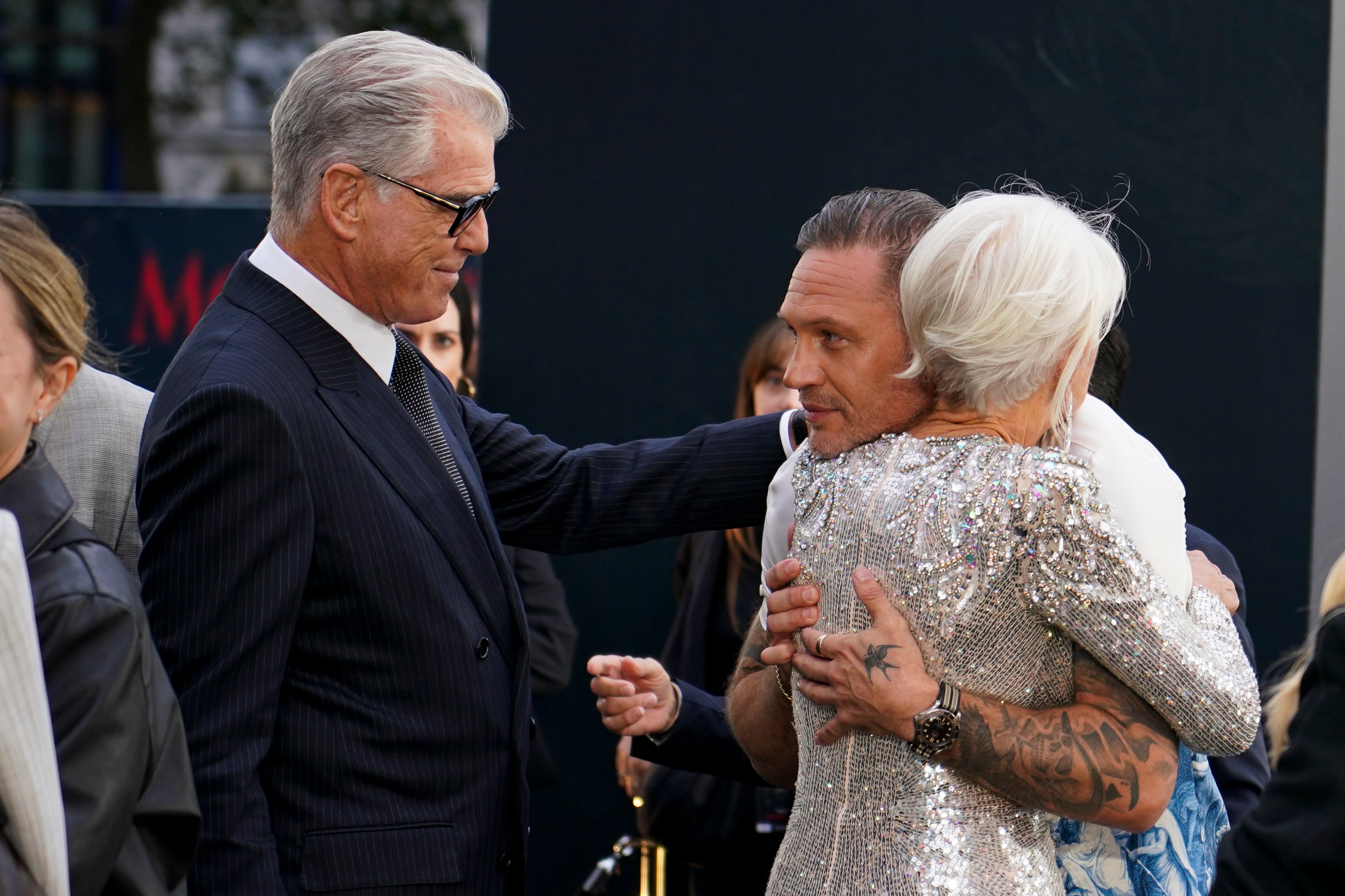 The pair embraced on the red carpet (AP)