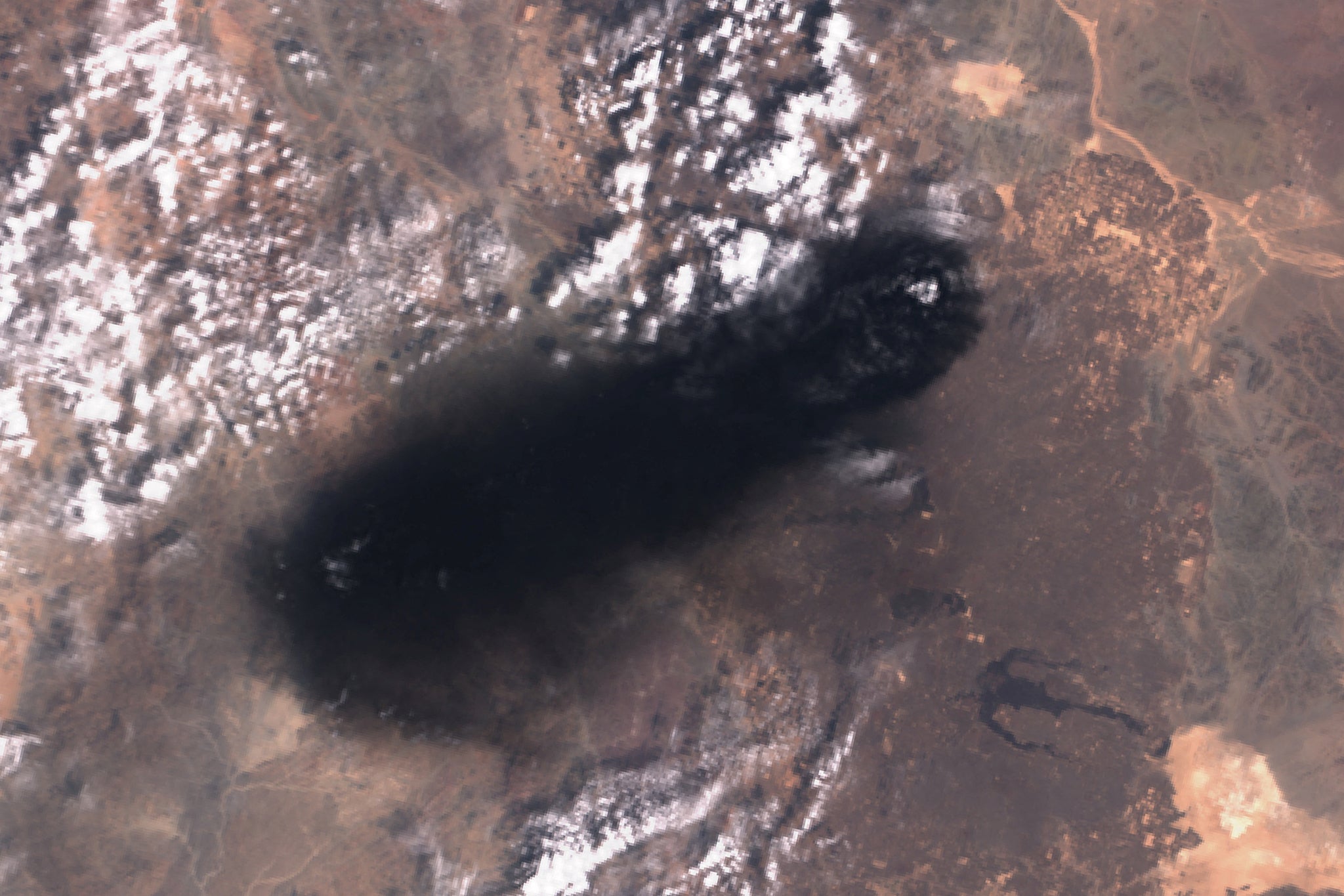 Black smoke rises from a section of Saudi Arabia’s East-West oil pipeline south of Medina, on September 10