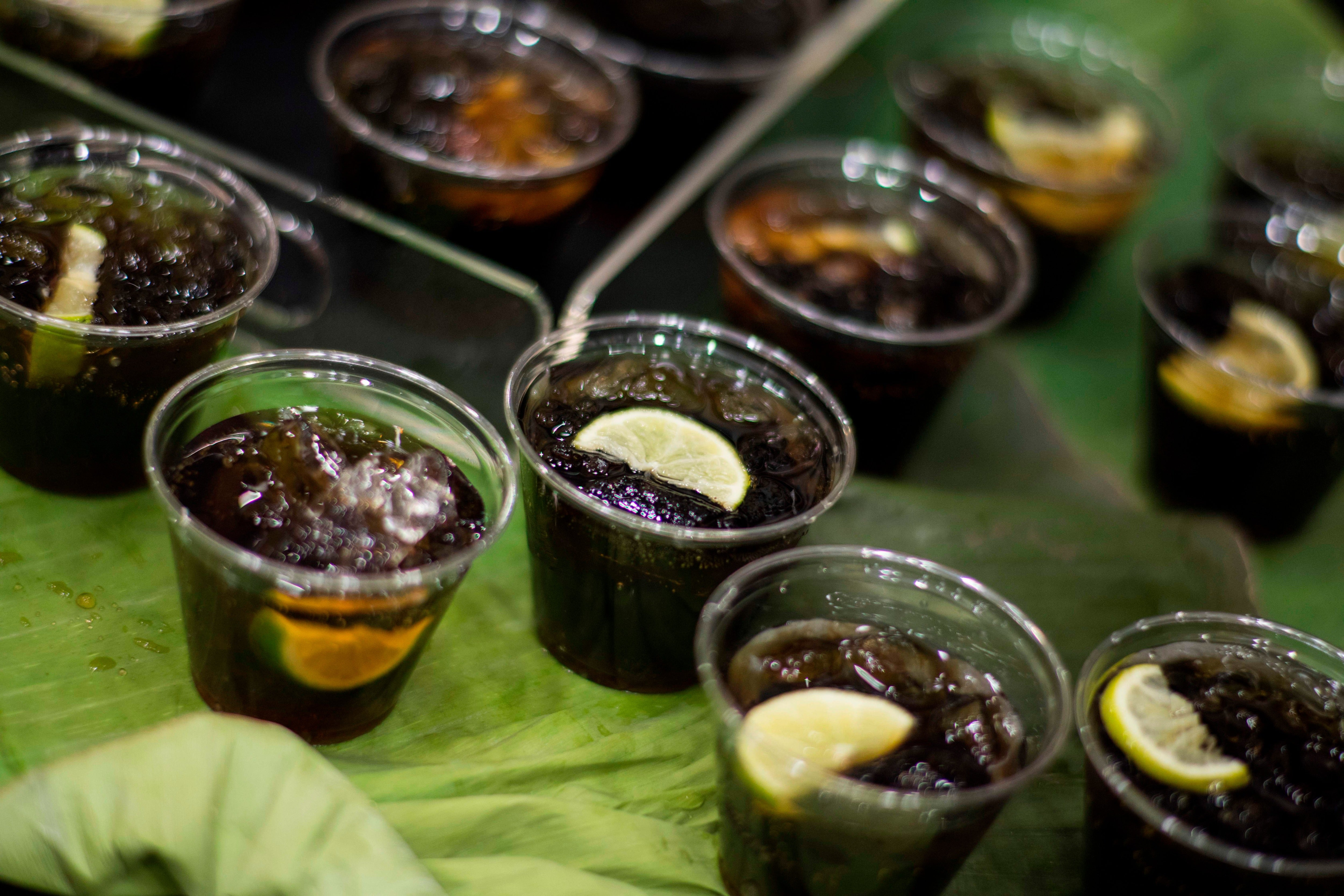 Rum is made by fermenting and distilling sugarcane juice or molasses