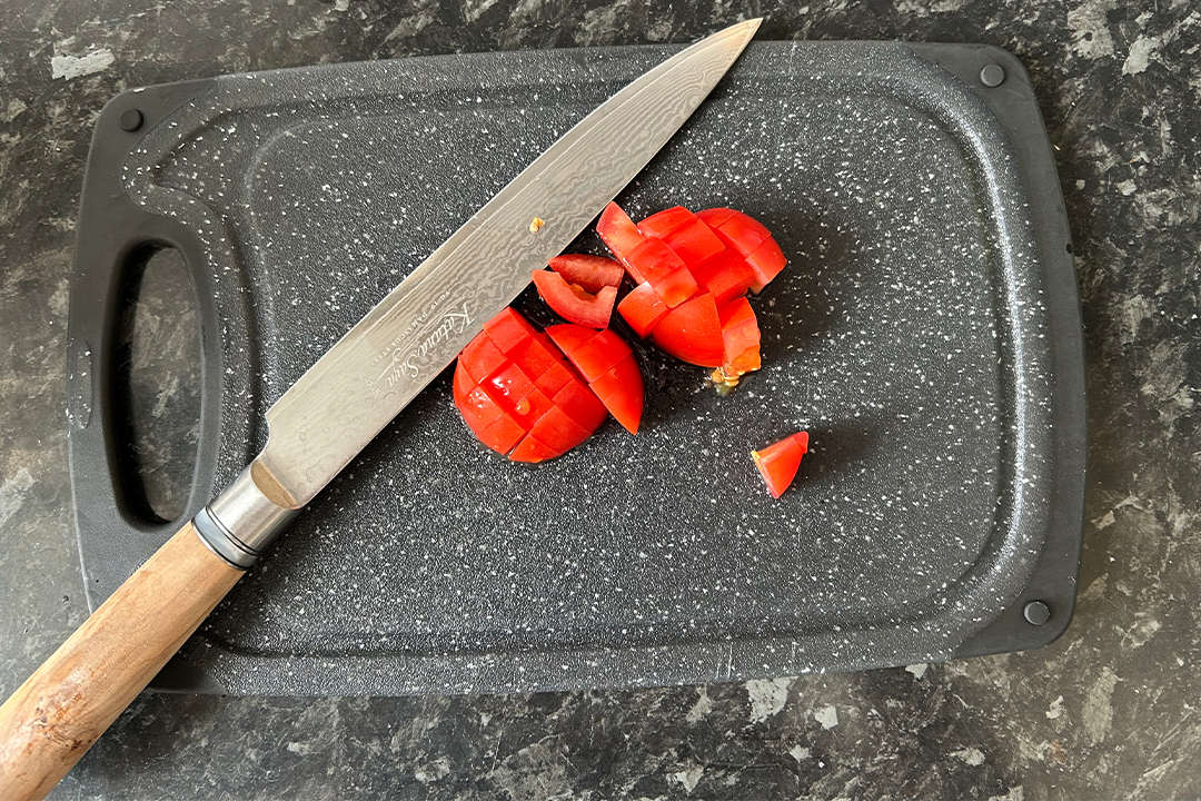 I used the knives on dense sweet potatoes, delicate tomatoes and more (Sarah Michael/The Independent)