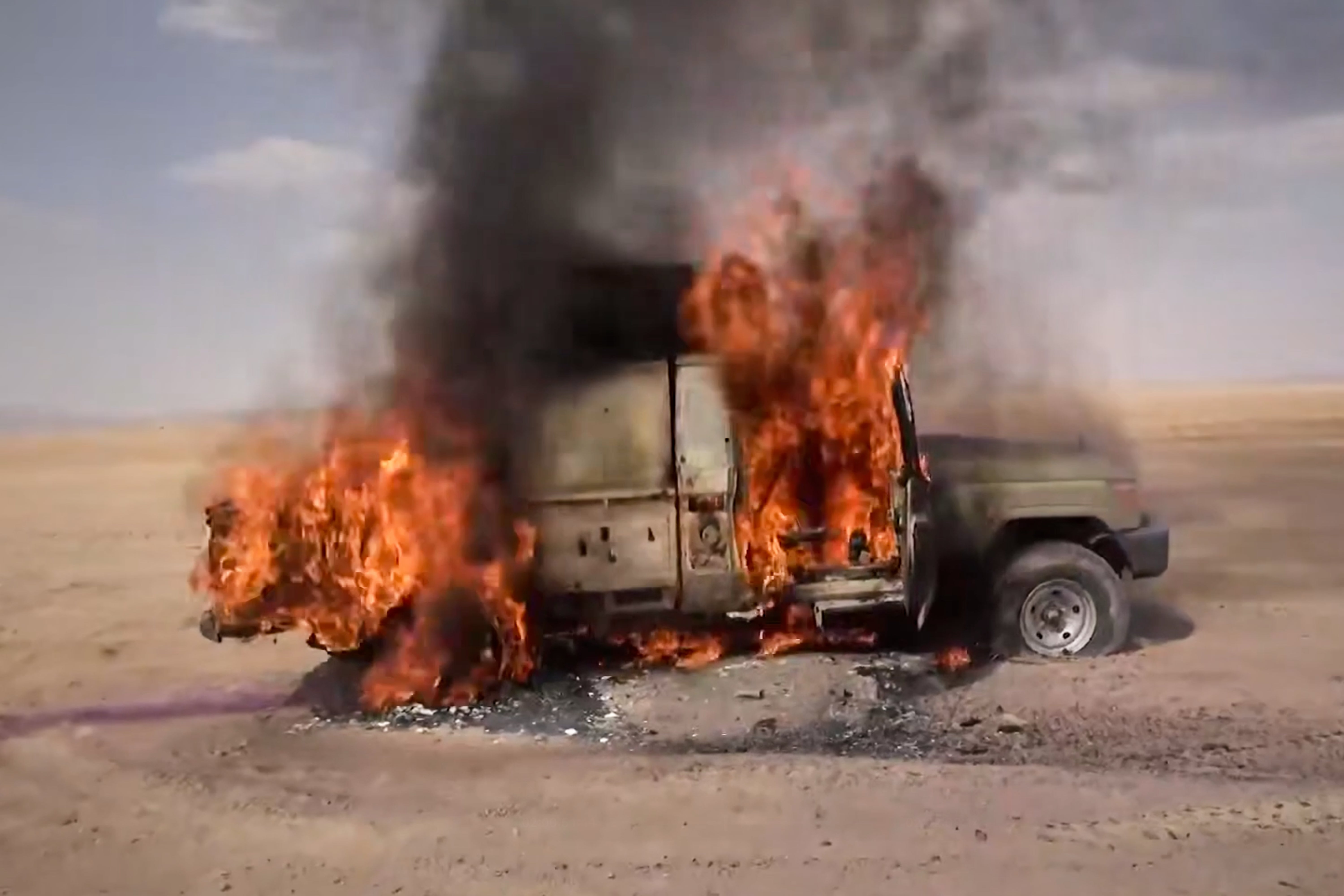 A pickup truck burning following what the Houthis described as an attack on Saudi-backed forces in eastern Jawf province, on 9 Sep