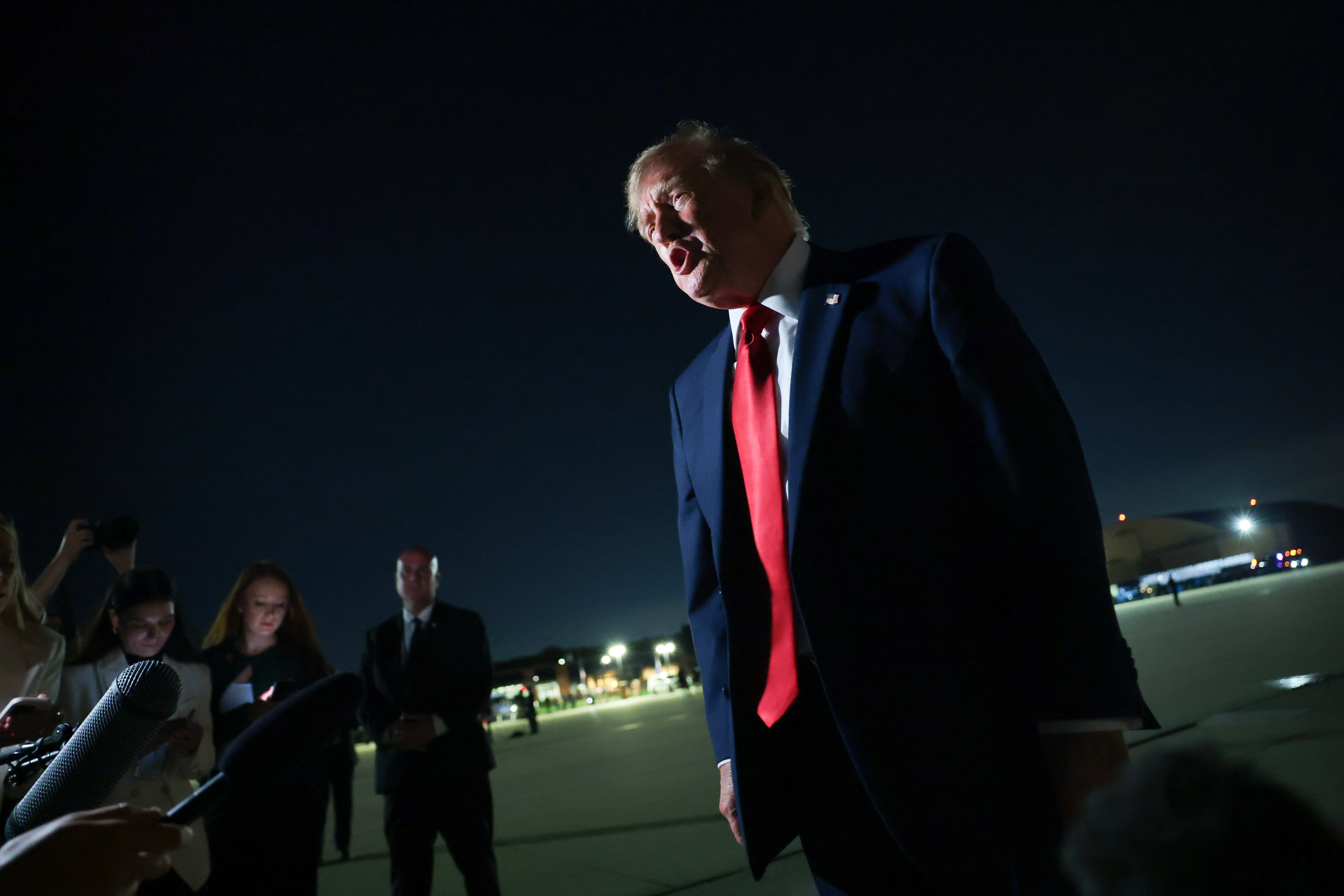 Donald Trump speaks to the media before boarding Air Force One to depart for his scheduled two-day visit to Ireland on September 11