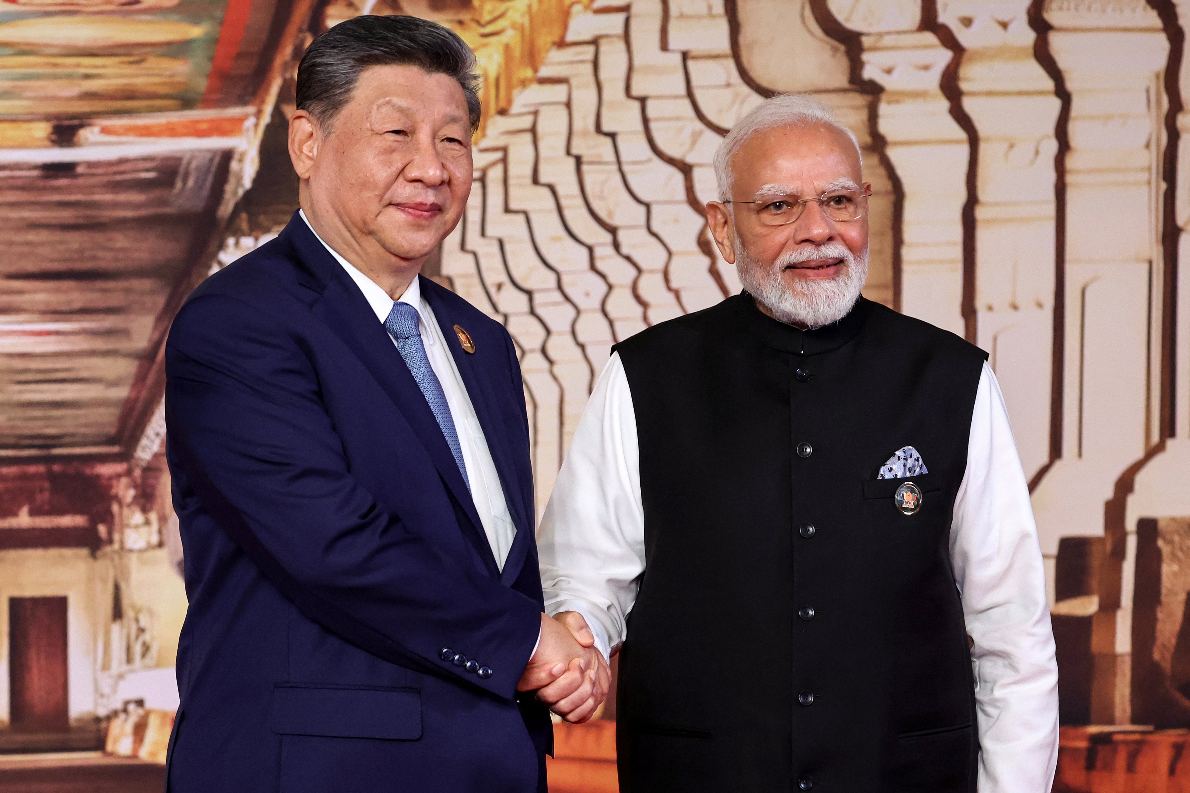 India's Narendra Modi shakes hands with China's Xi Jinping during a welcome ceremony in Delhi (AFP/Getty)