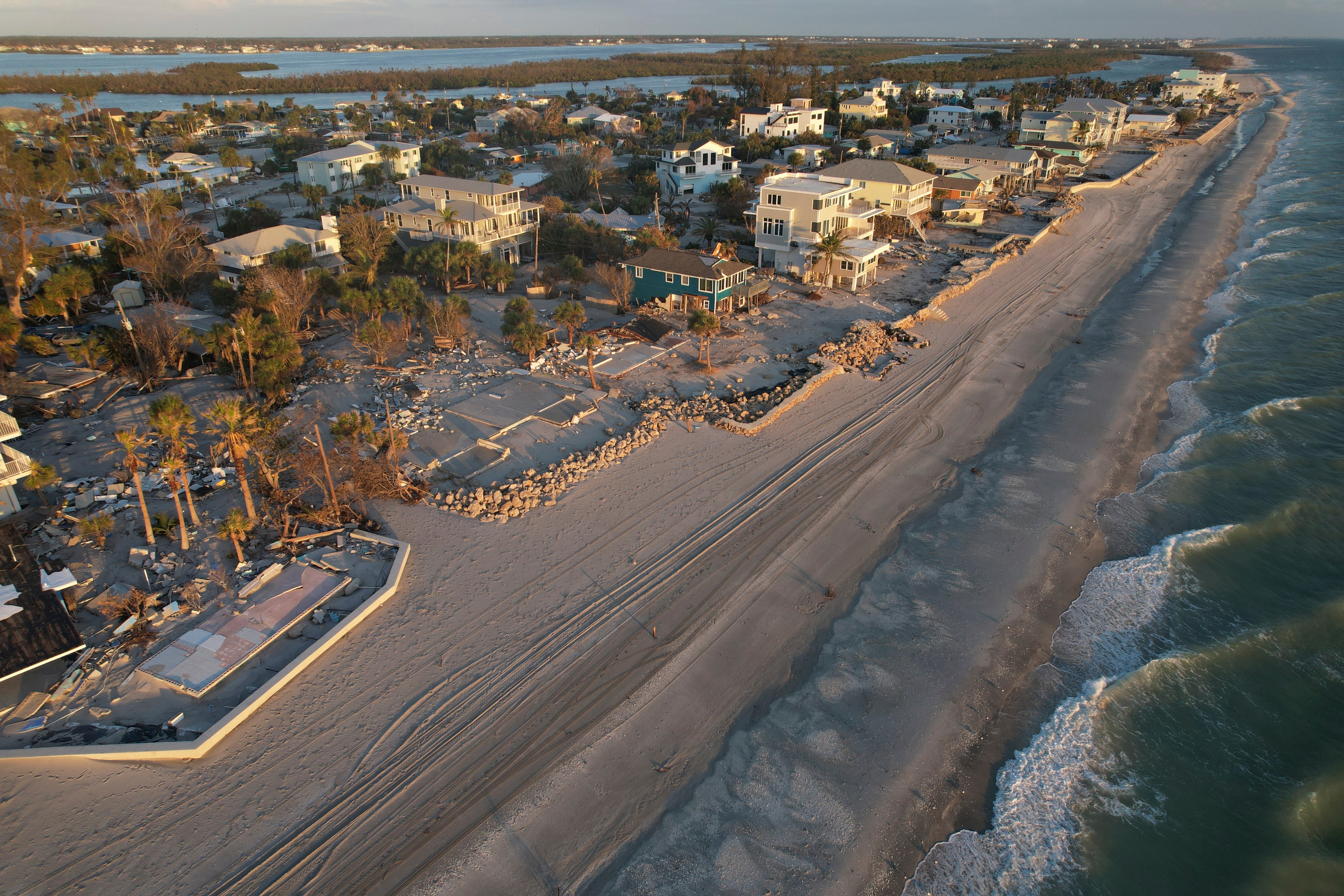 Waves roll in from the Gulf of Mexico toward lots where only empty foundations and debris remain after homes were swept away in Hurricane Milton on Manasota Key in Englewood, Fla., Oct. 13, 2024. (AP Photo/Rebecca Blackwell, File)