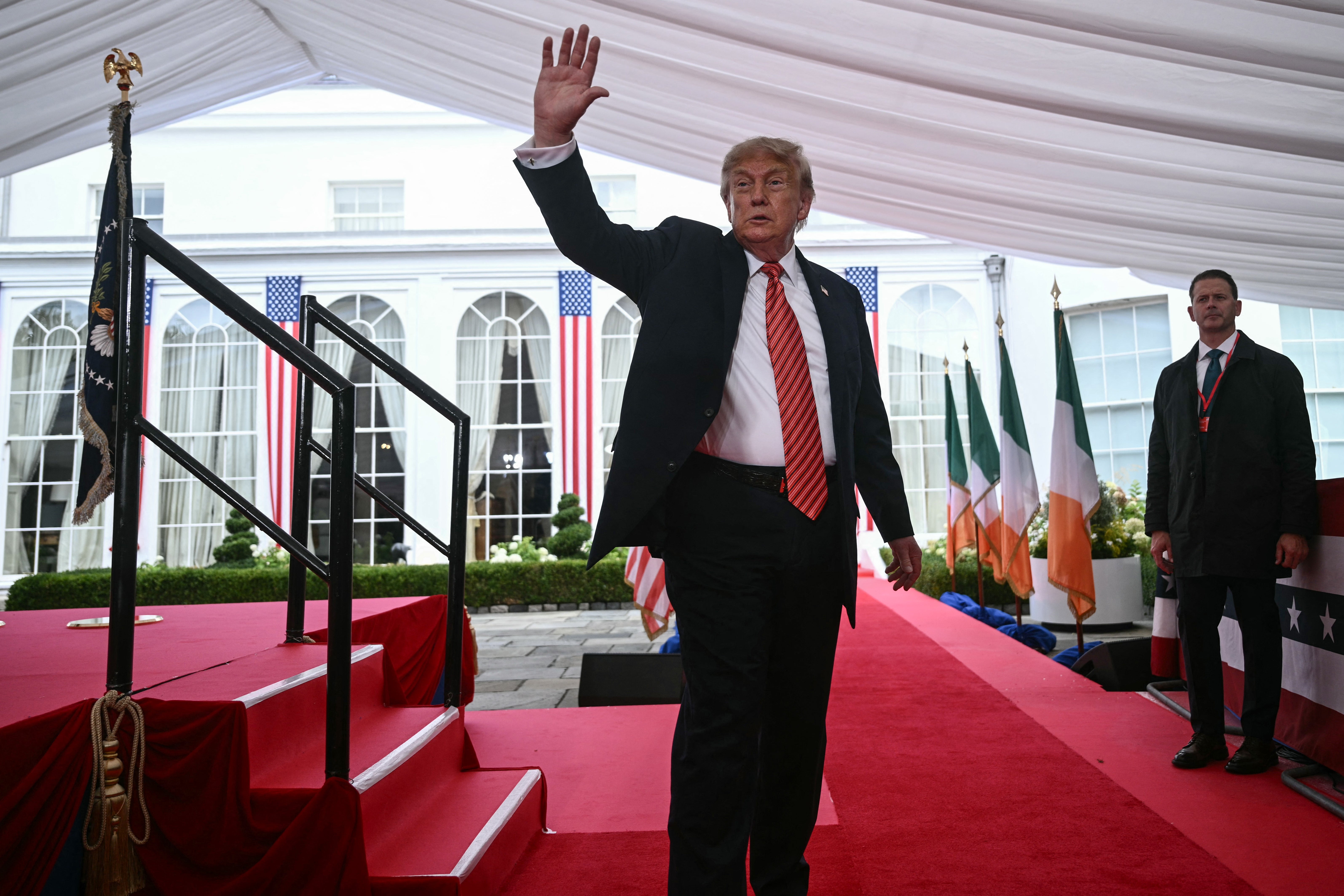 Mr Trump waves after giving a speech at a special function during his visit to the US ambassador's residence in Dublin