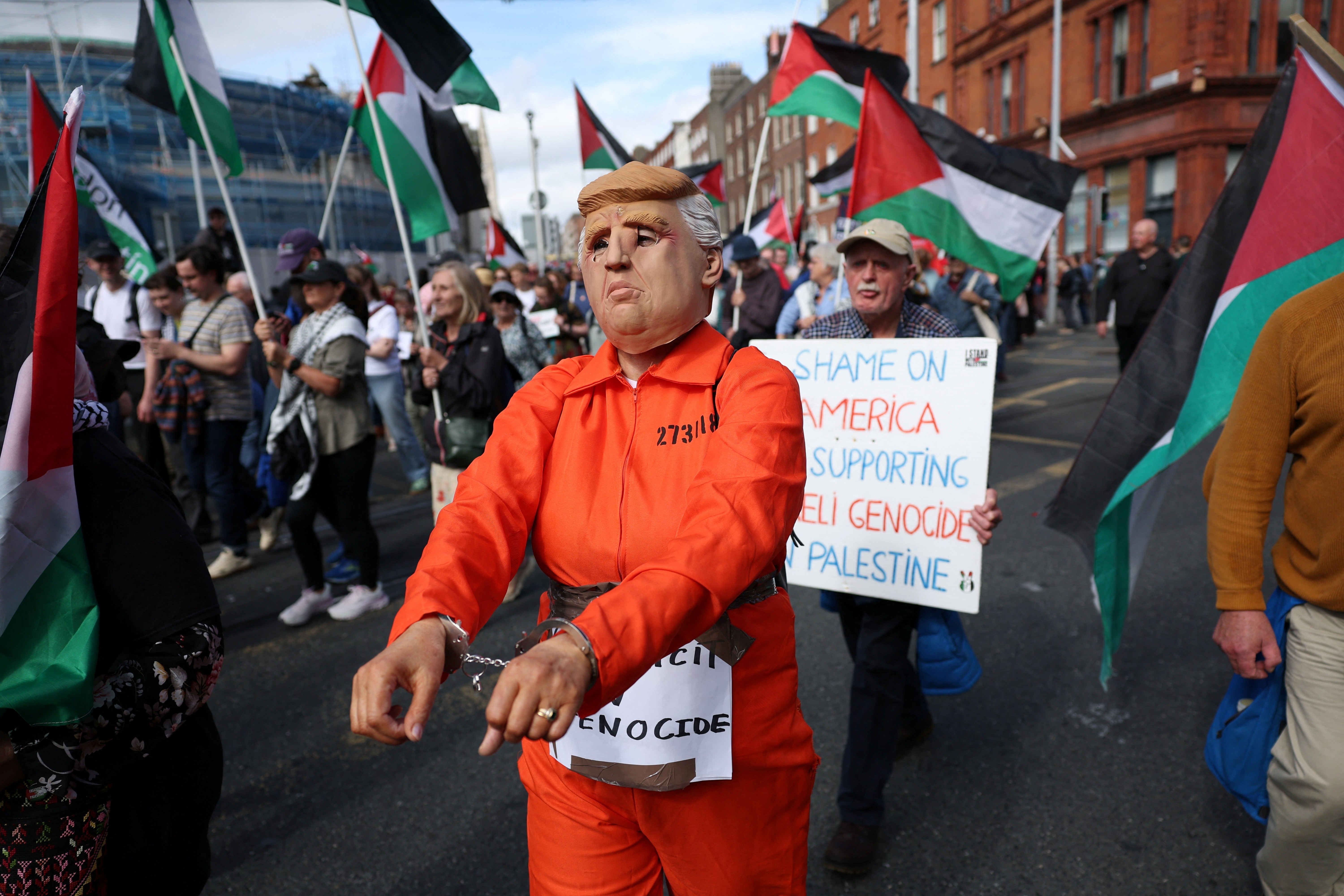 People take part in a protest against the visit of Mr Trump in Dublin