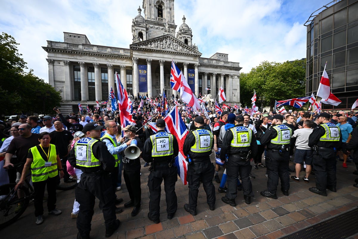 Man arrested after police van targeted at anti-migrant protest in Portsmouth