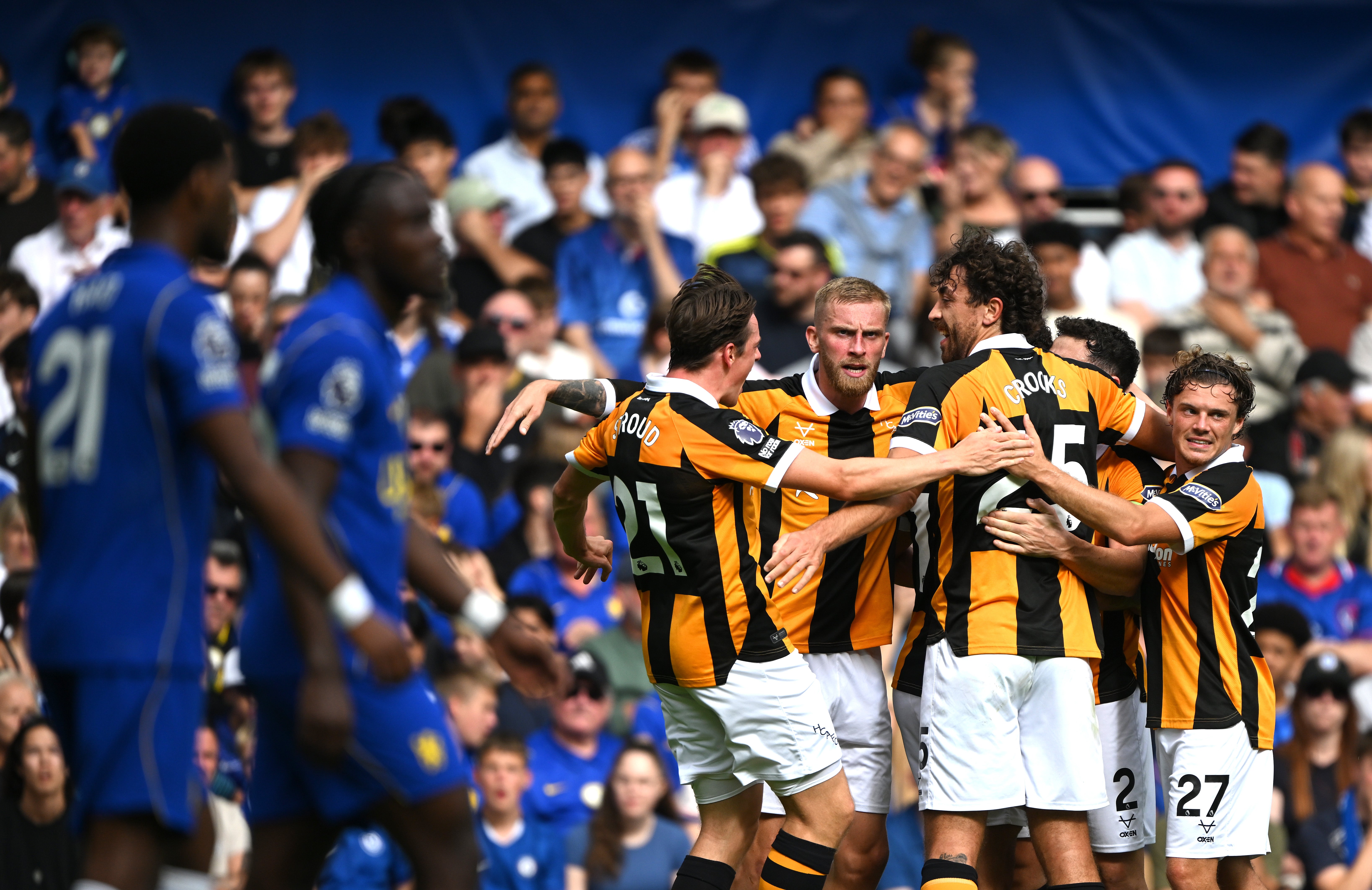 Hull players celebrate after equalising at Stamford Bridge