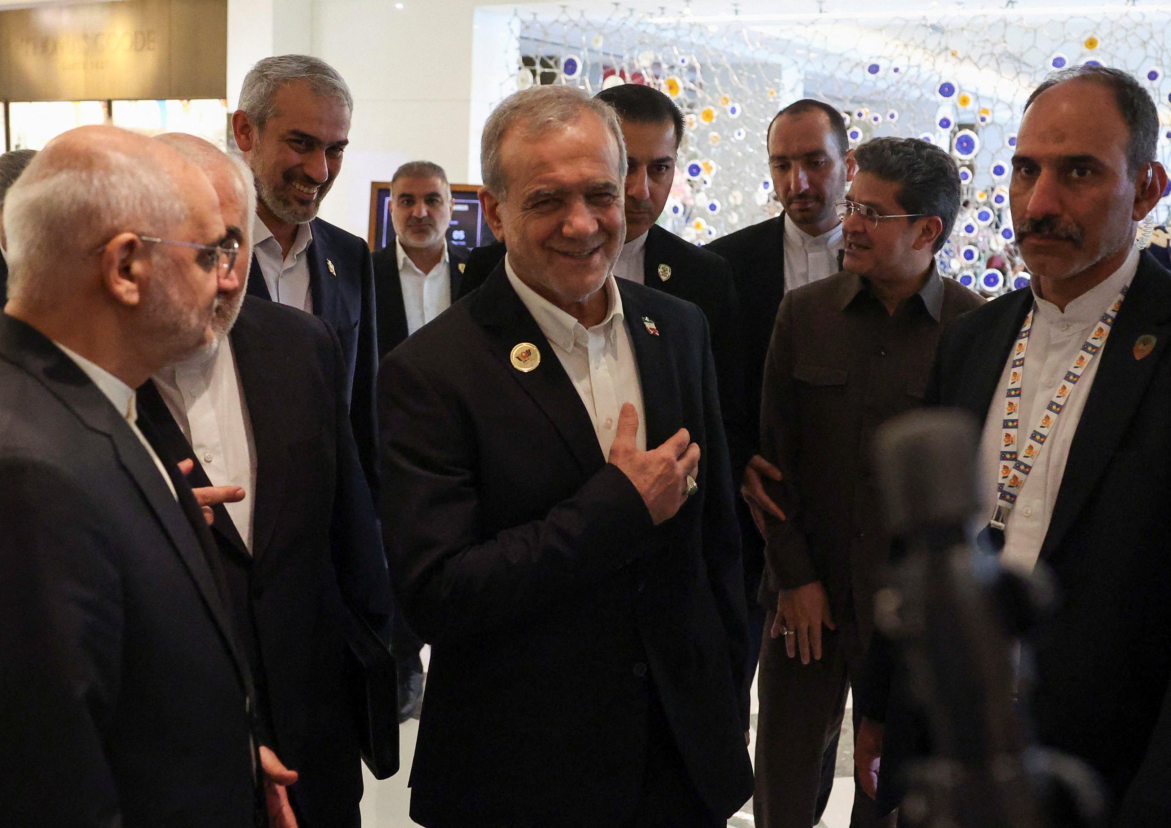 Iranian president Masoud Pezeshkian reacts as he is greeted inside a hotel, during his visit to India to attend the 18th Brics Summit, in New Delhi, India, 12 September 2026