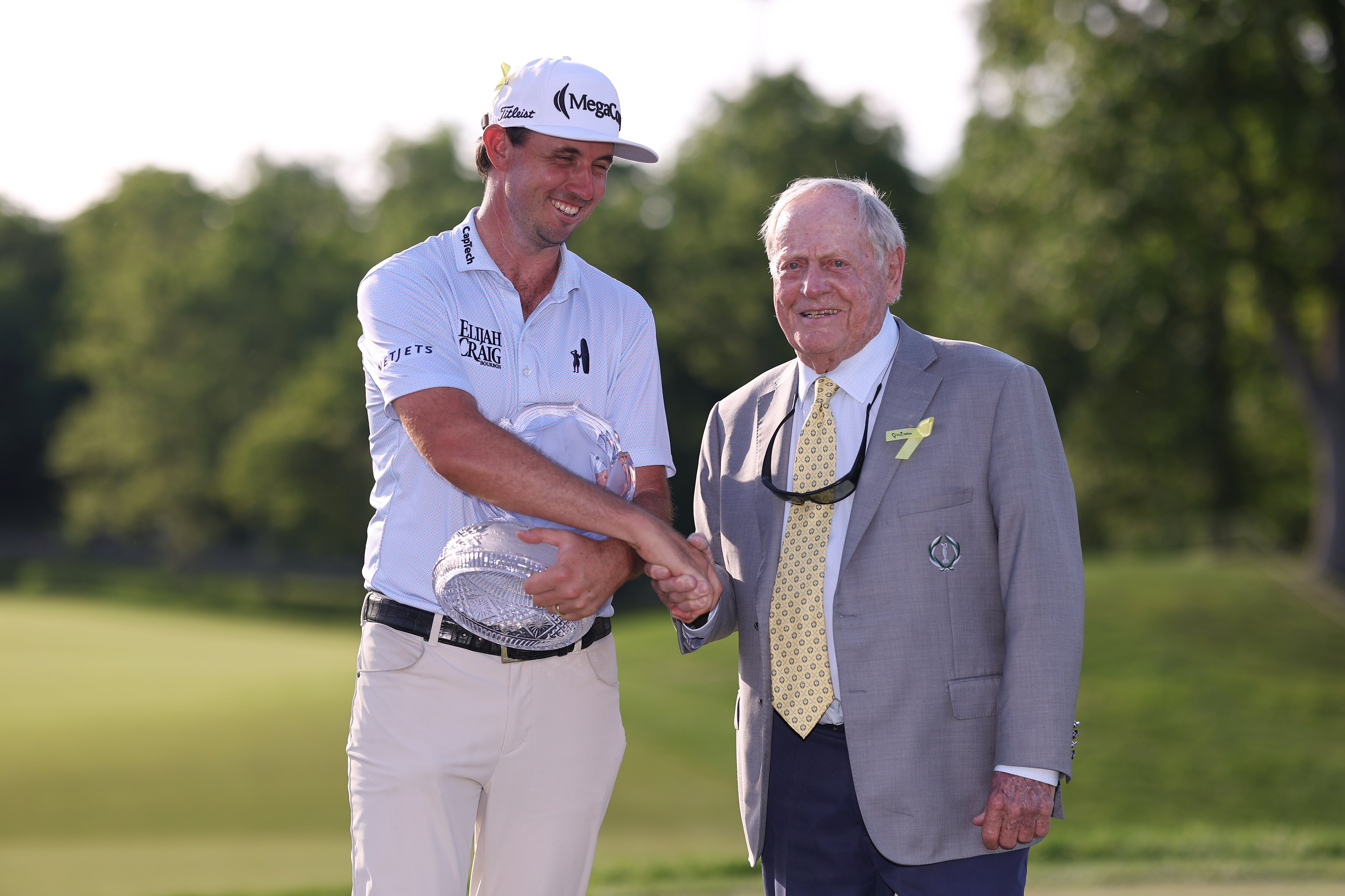 J.T. Poston of the United States shakes hands with Jack Nicklaus as he presents him the trophy during the final round of the the Memorial Tournament presented by Workday 2026 at Muirfield Village Golf Club on June 07, 2026 (Getty)