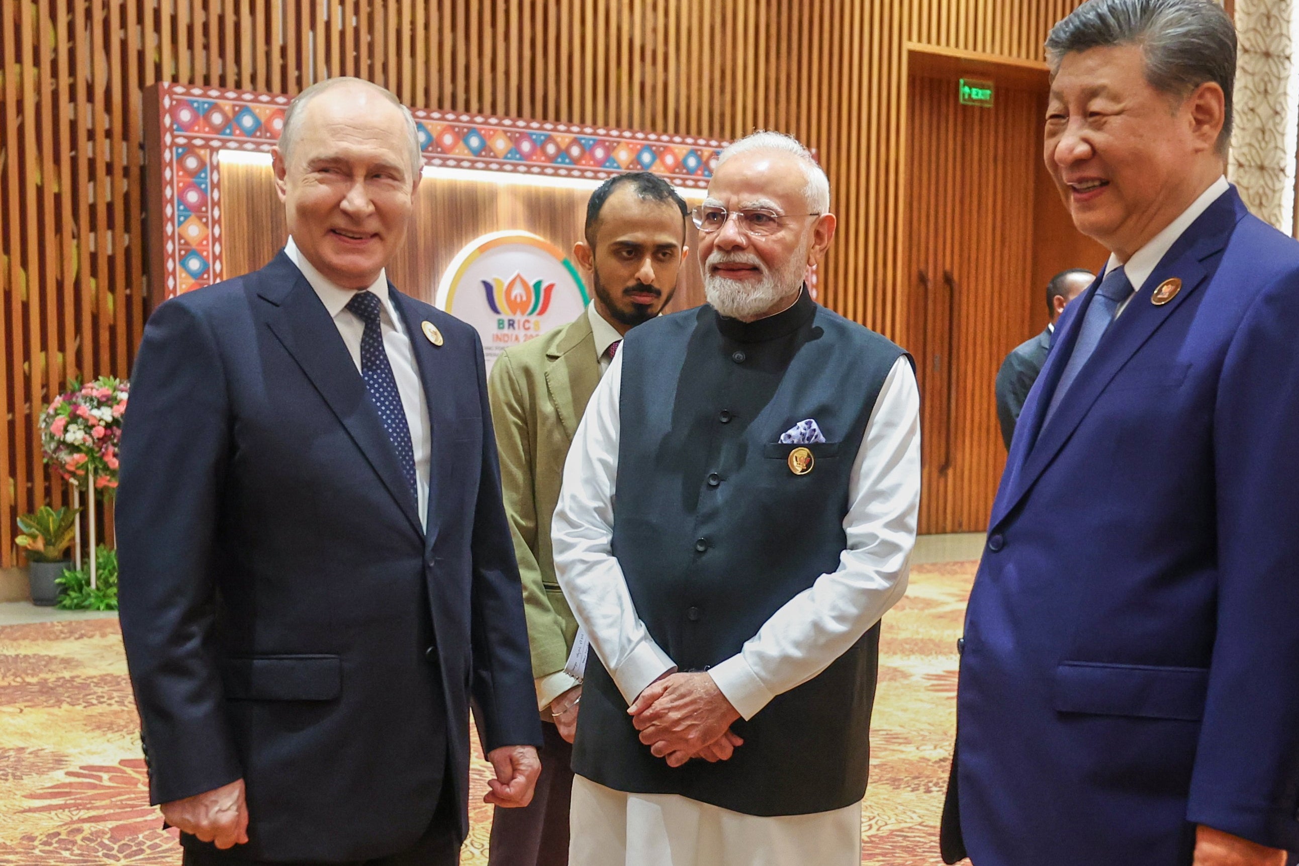 Narendra Modi, center, reacts with Russian President Vladimir Putin, left, and Chinese President Xi Jinping during the BRICS summit
