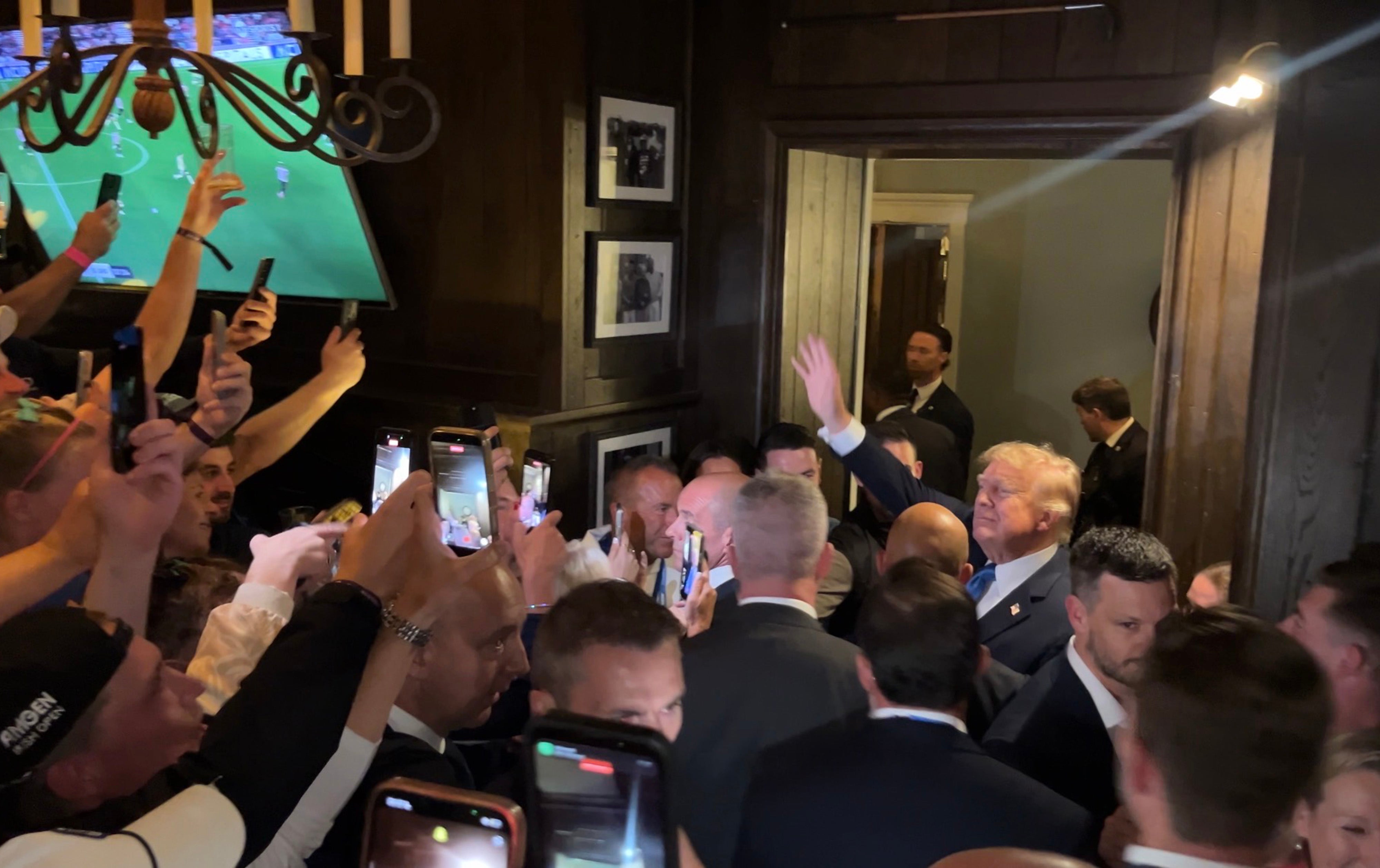 US President Donald Trump walks through the members bar of his Doonbeg golf resort as he attends the Irish Open, during his trip to the Republic of Ireland (PA)