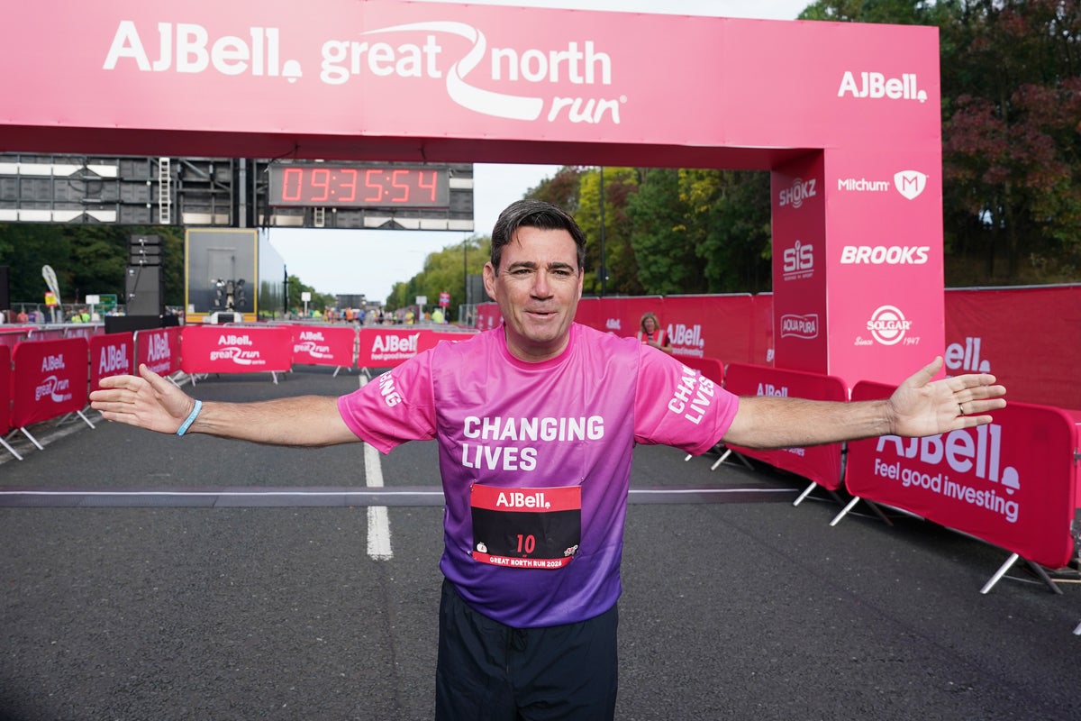 Andy Burnham runs Great North Run as PM hands over salary donation to charity