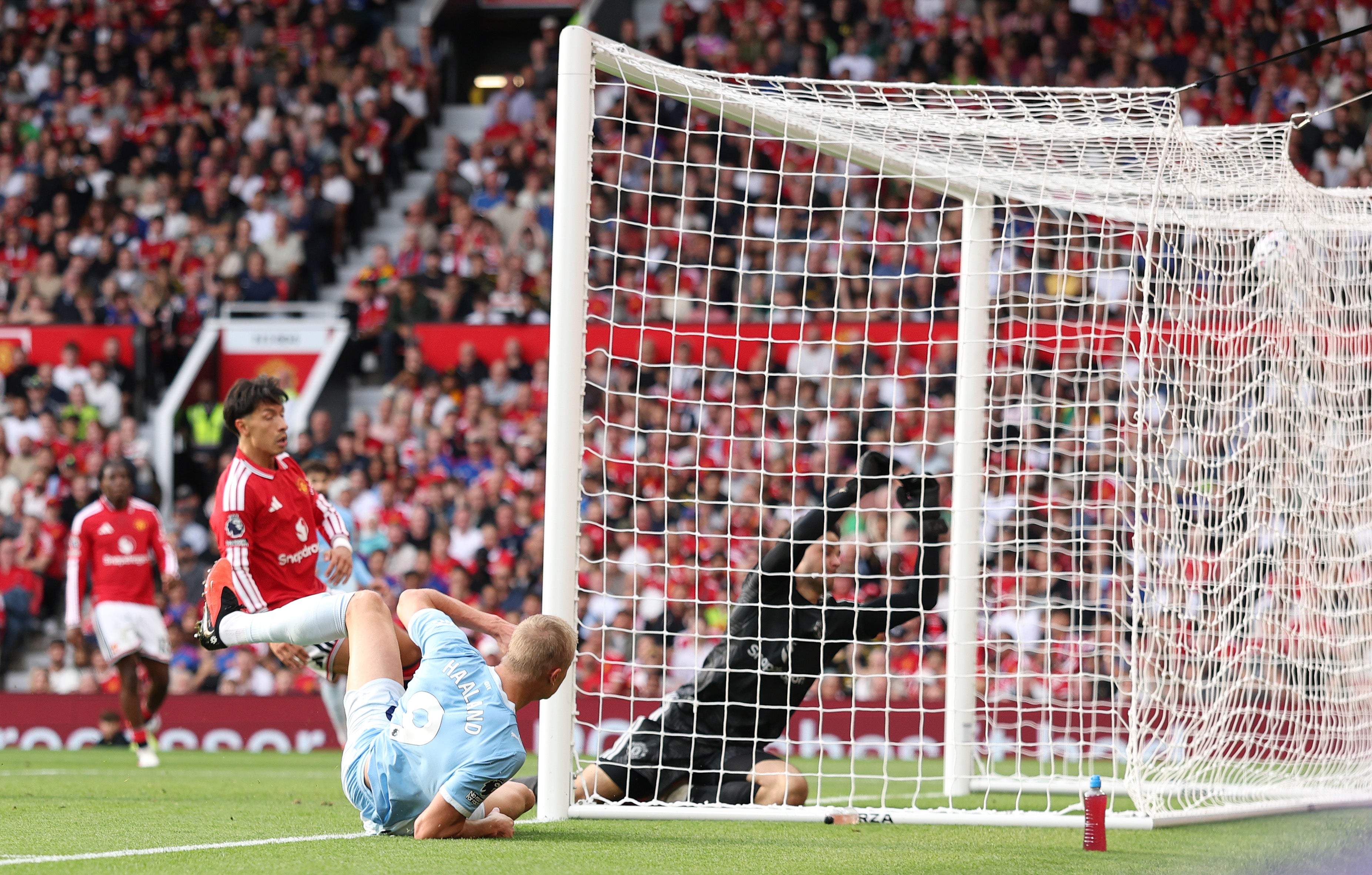 Erling Haaland bundled in in the second half to give 10-man City a memorable away win